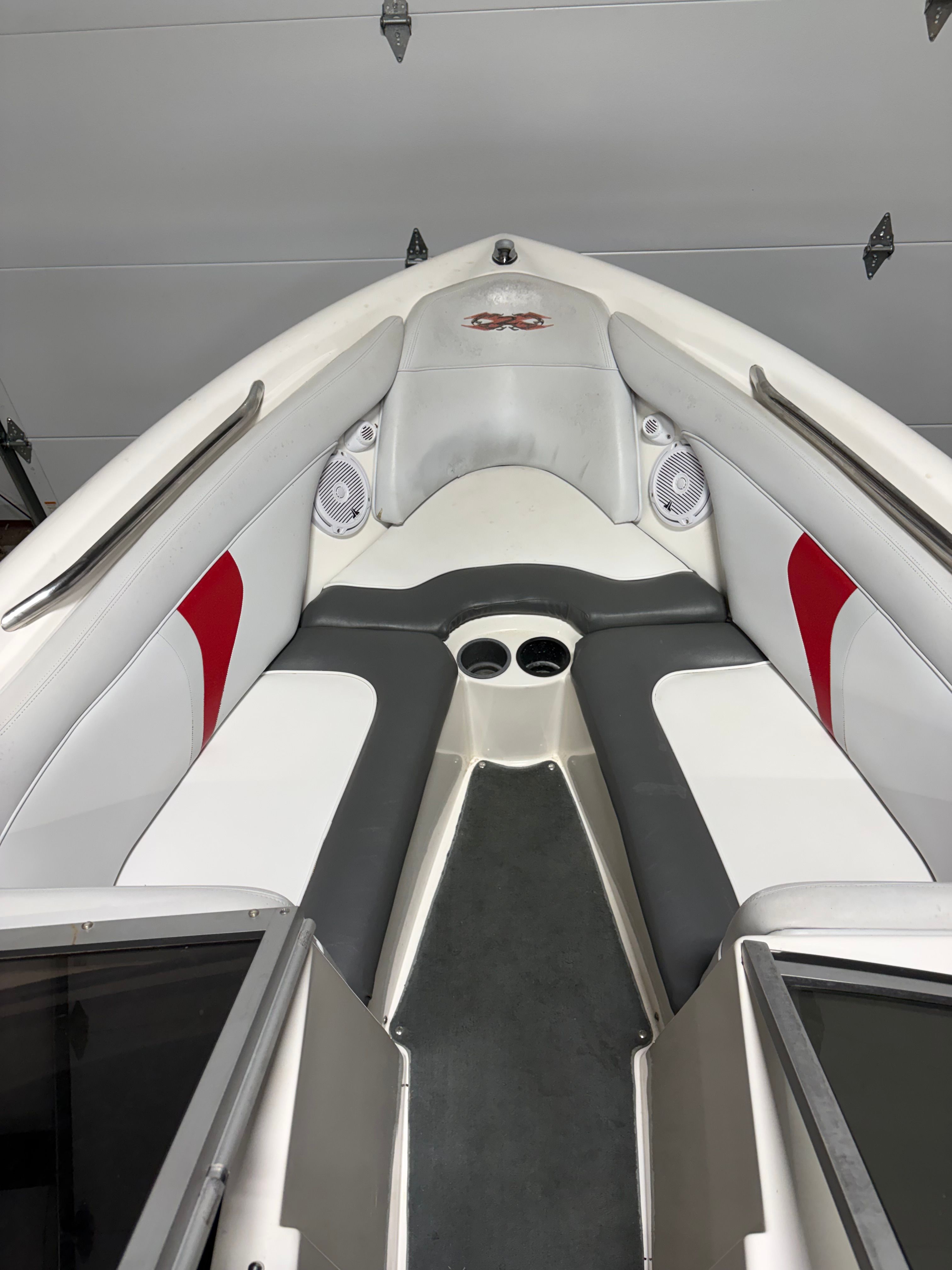 Interior of a 2004 MasterCraft X2 boat with gray and red accents.