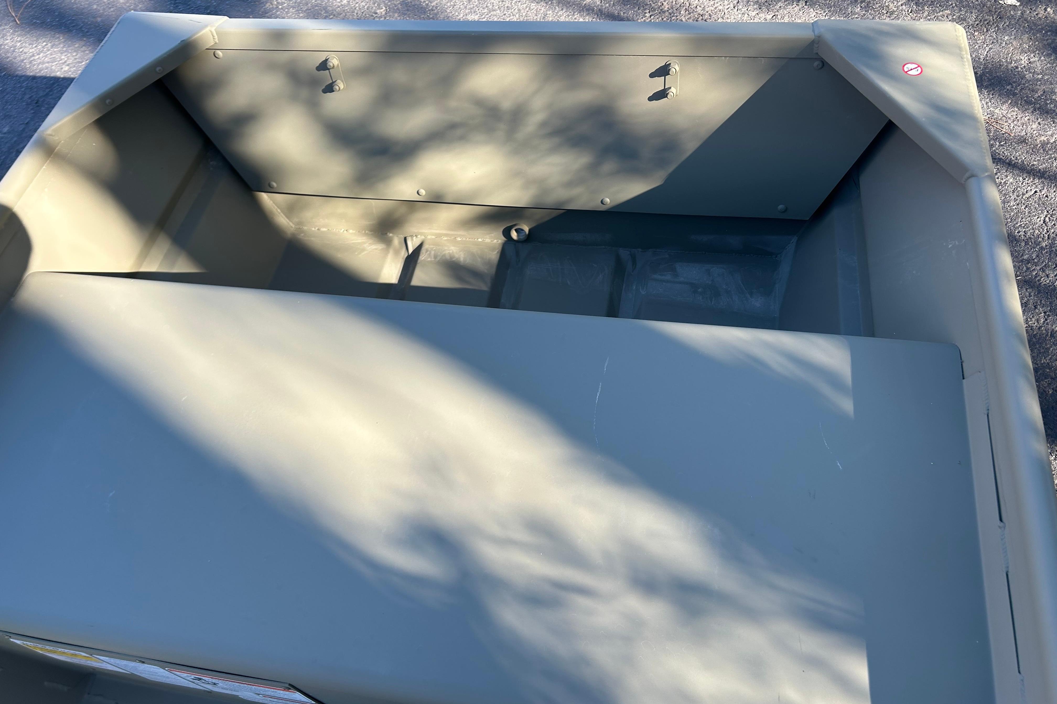 2026 Tracker Grizzly 12 Jon boat interior with shadow patterns on the surface.