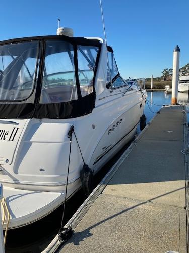 2004 Chaparral Signature 350 boat docked at marina under clear blue sky.