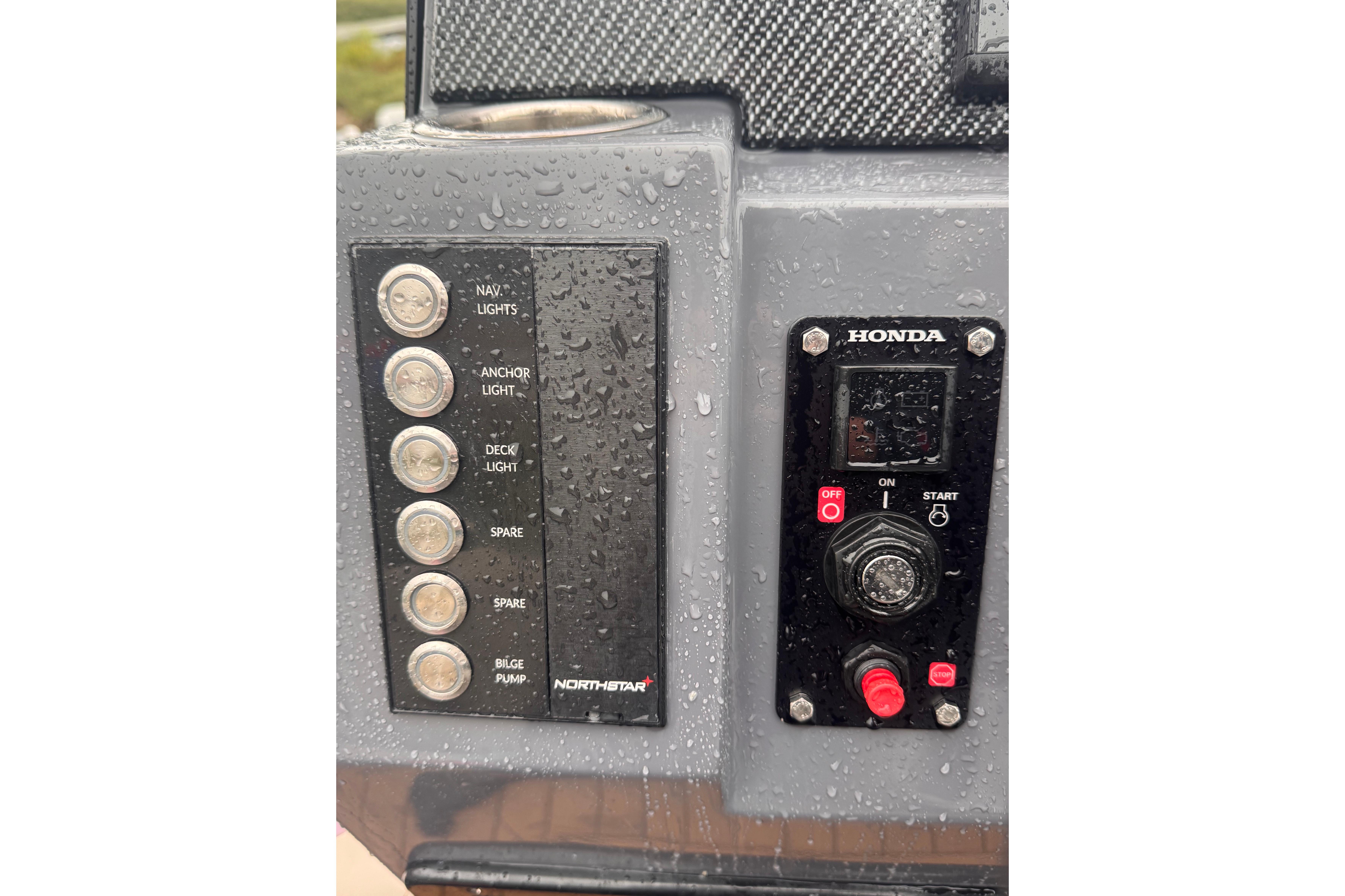 Control panel of 2024 Northstar Axis 4.8 boat with Honda engine switches.