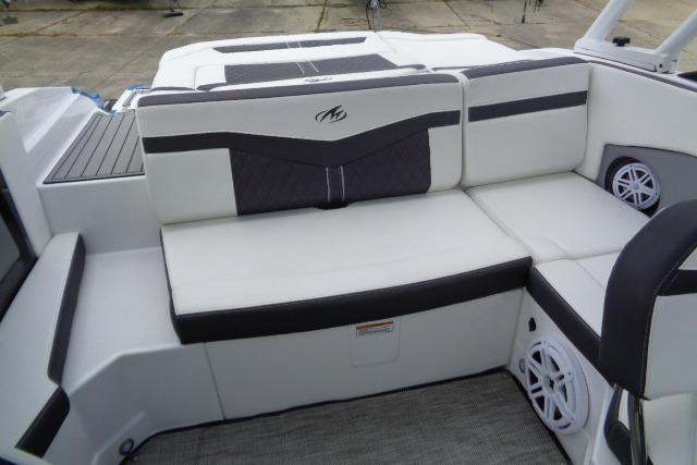 2019 Monterey 218SS Super Sport boat interior with white and black seating, featuring built-in speakers.