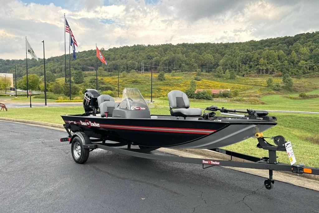 2026 Tracker Bass Tracker Classic XL boat on trailer, parked outdoors with scenic background.