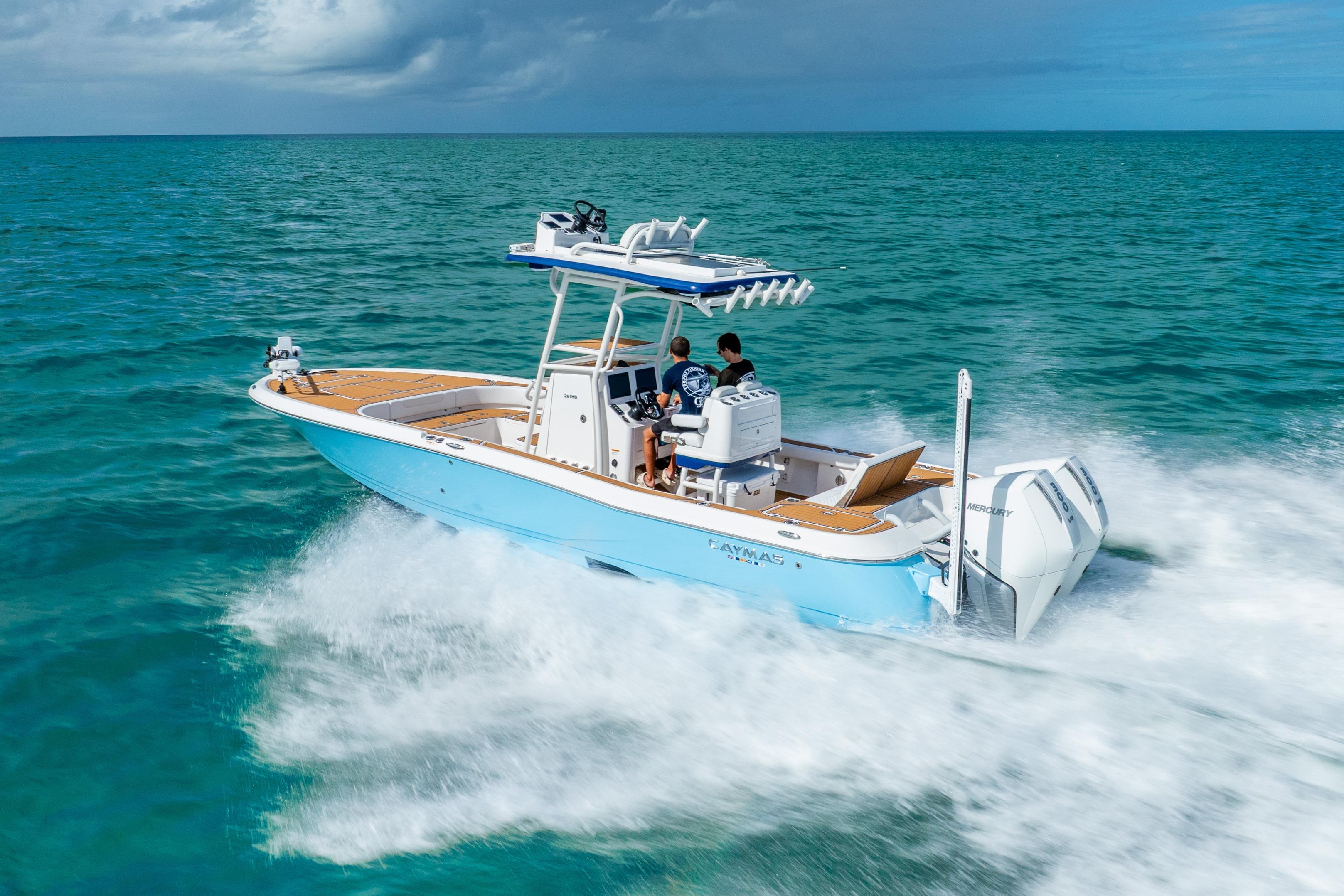 2024 Caymas 281 HB boat cruising on open ocean waters.