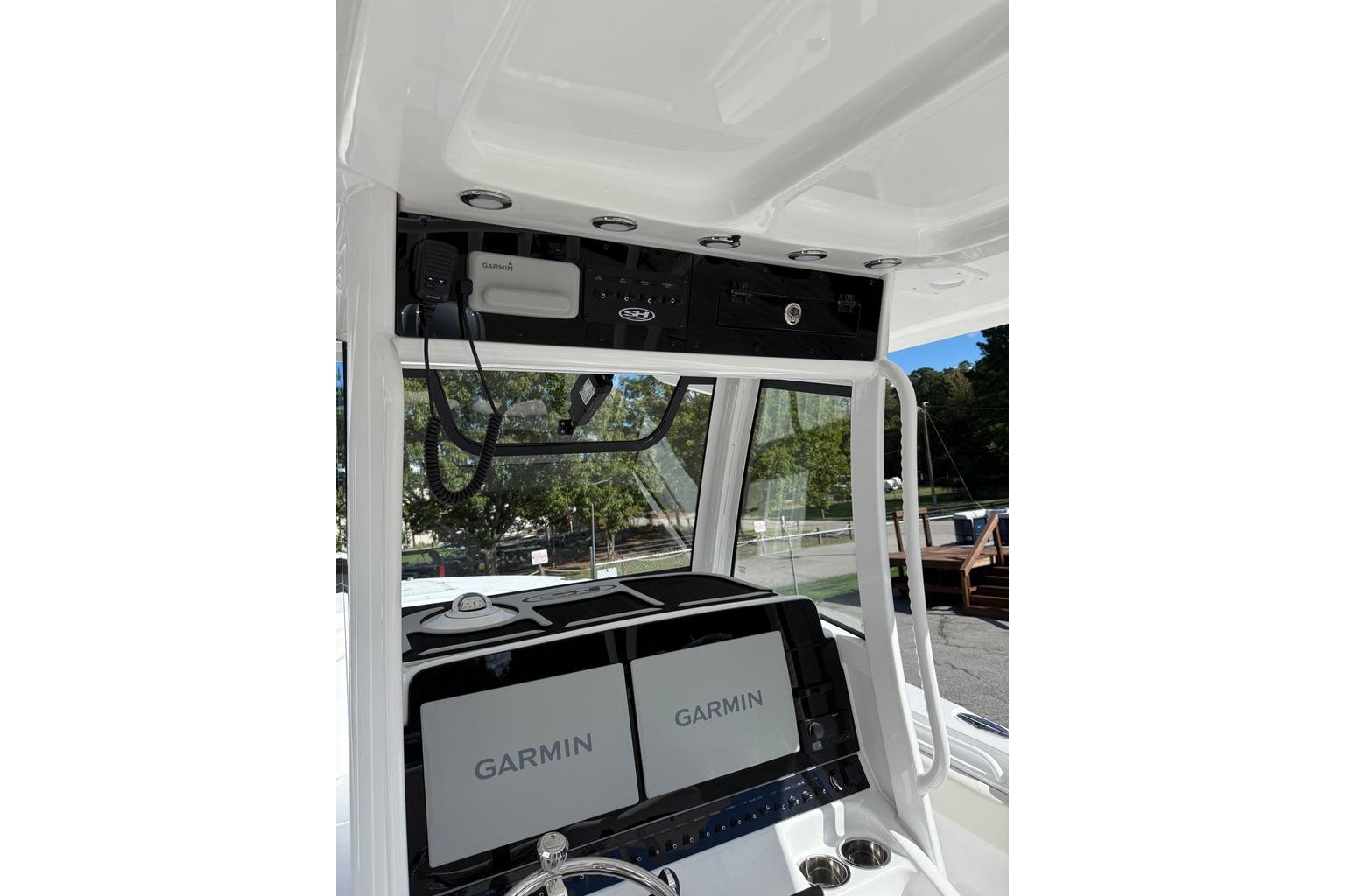 2026 Sea Hunt Ultra 285 Coffin Box boat dashboard with Garmin navigation system.