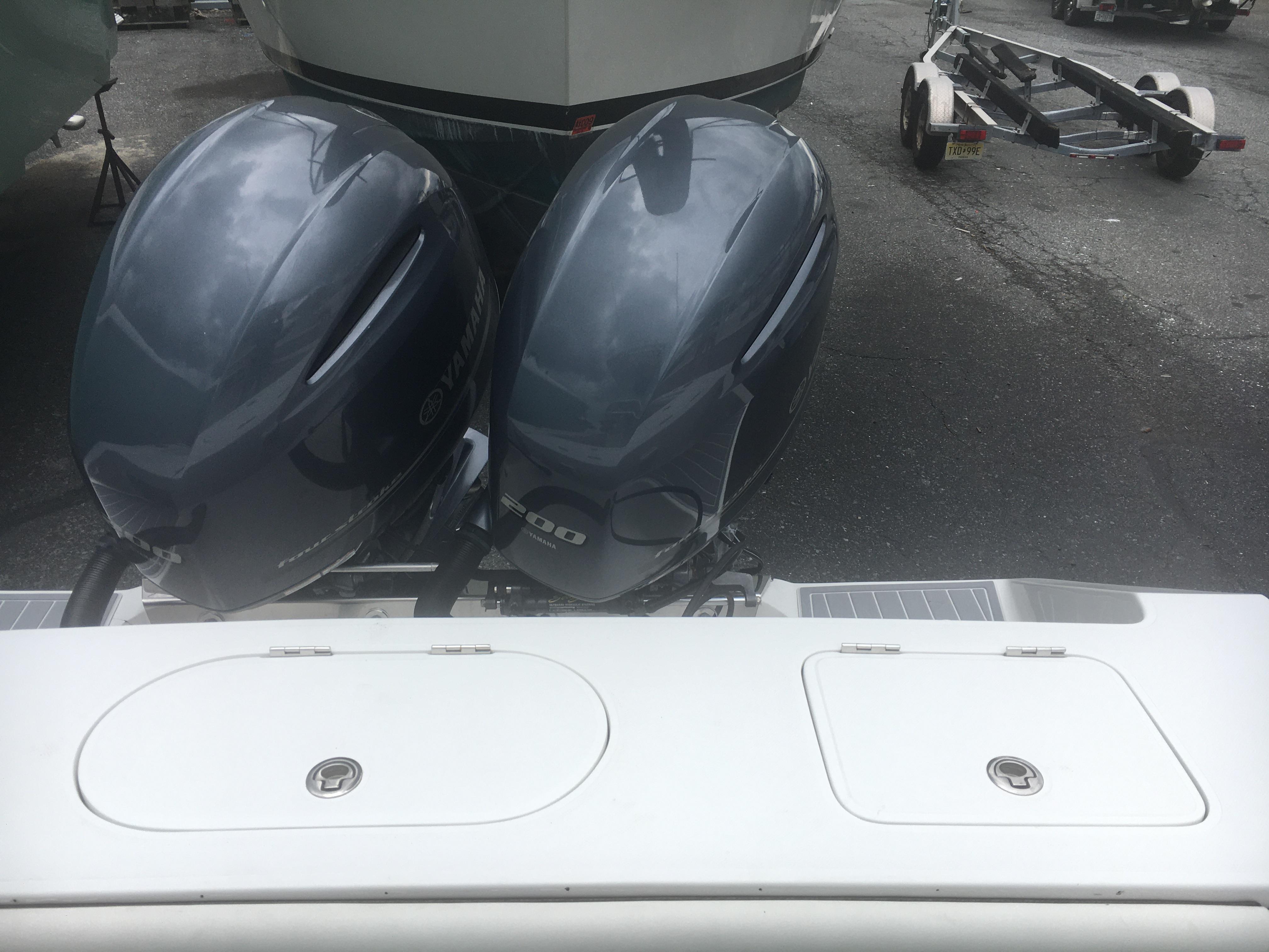 2012 Jupiter 26 Forward Seating boat with dual outboard engines.