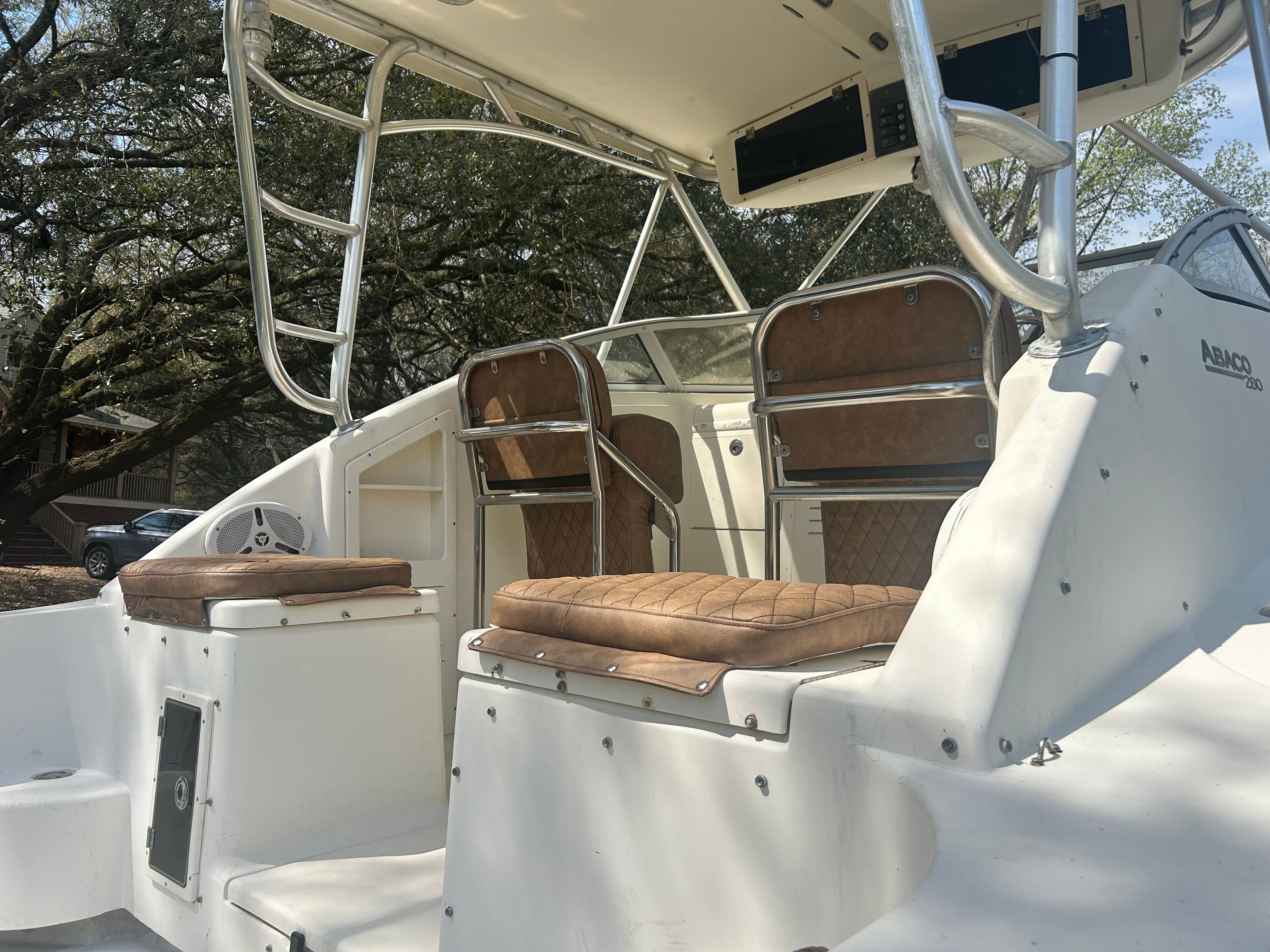 The image shows the cockpit of a 2003 Scout 280 Abaco with two cushioned seats.