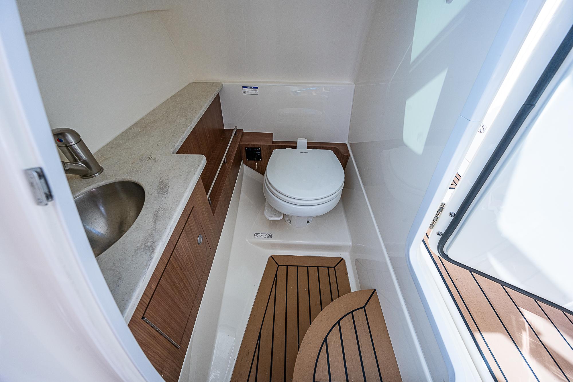 2018 Boston Whaler 270 Vantage boat bathroom with sink and toilet.