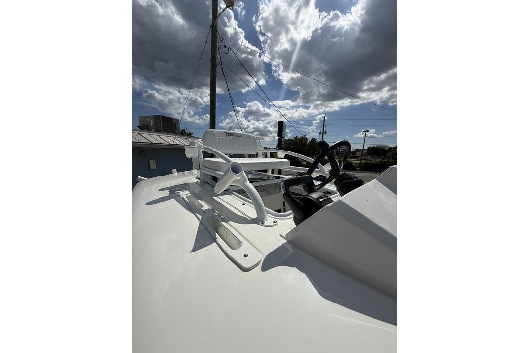 2026 Pathfinder 2800 Hybrid boat helm under cloudy sky.