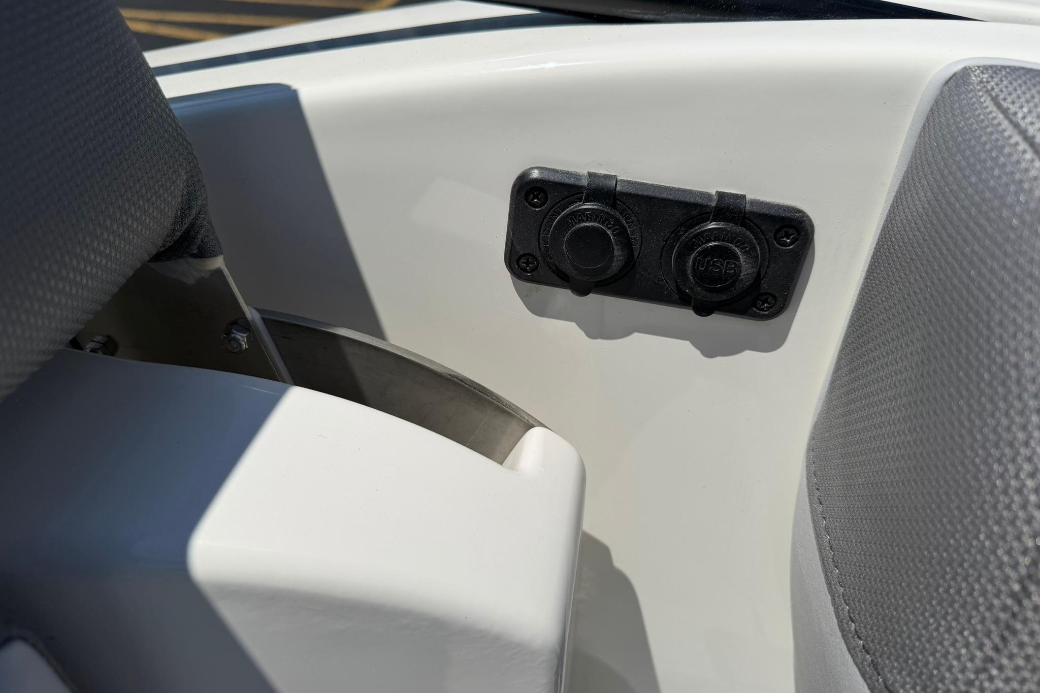 2026 Bayliner D20 boat interior with USB ports and seating detail.