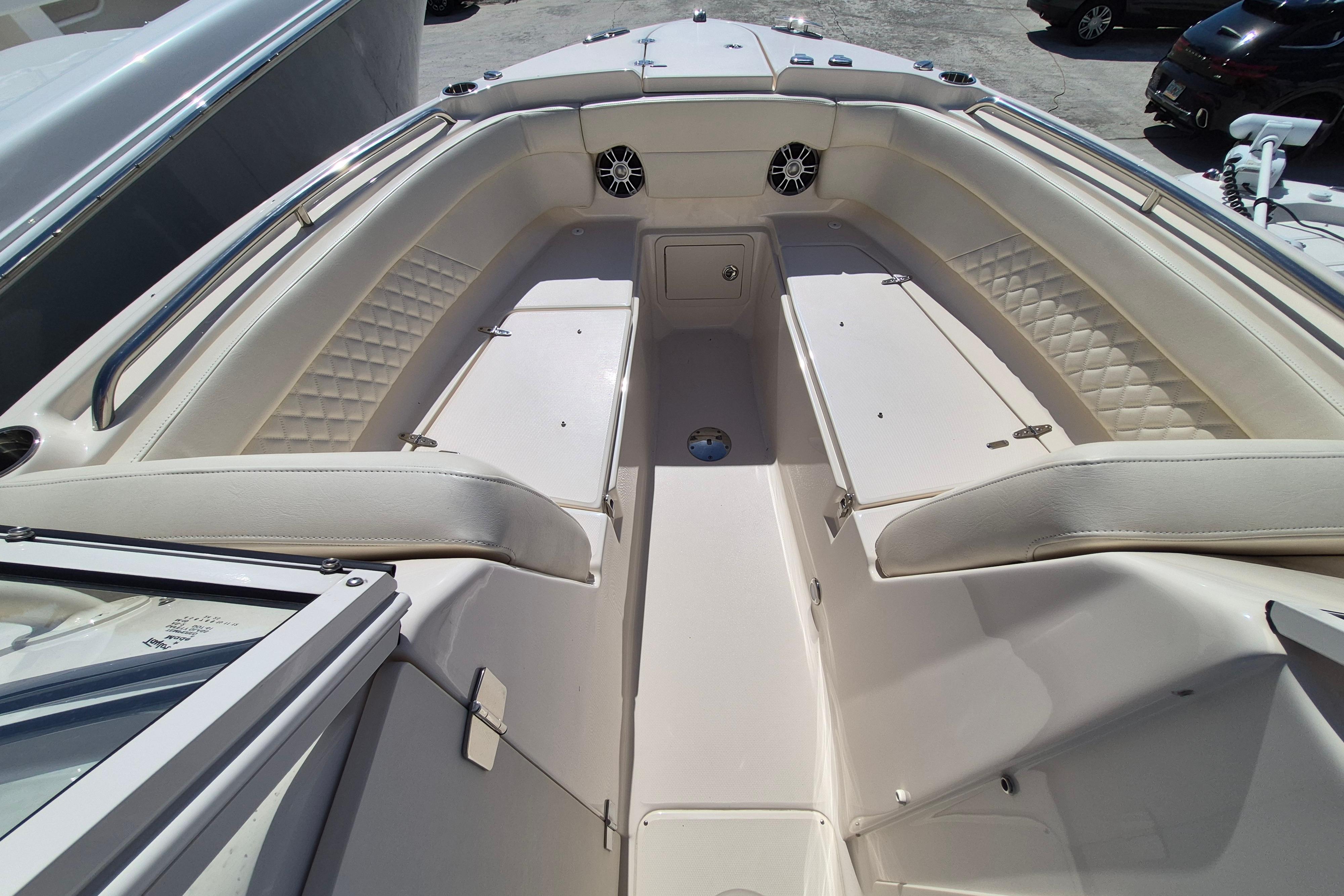 2025 Grady-White Freedom 275 boat interior with cushioned seating and storage compartments.