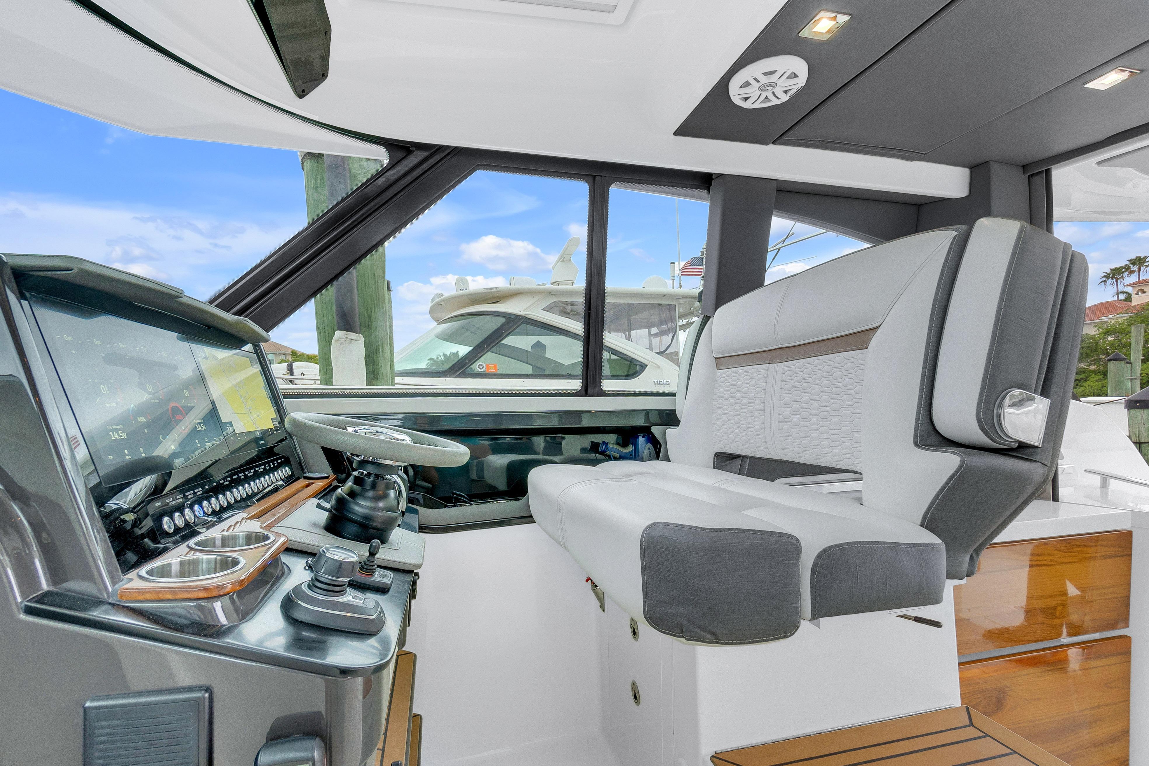 2021 Tiara Sport 43 LE helm with modern controls and luxurious seating.