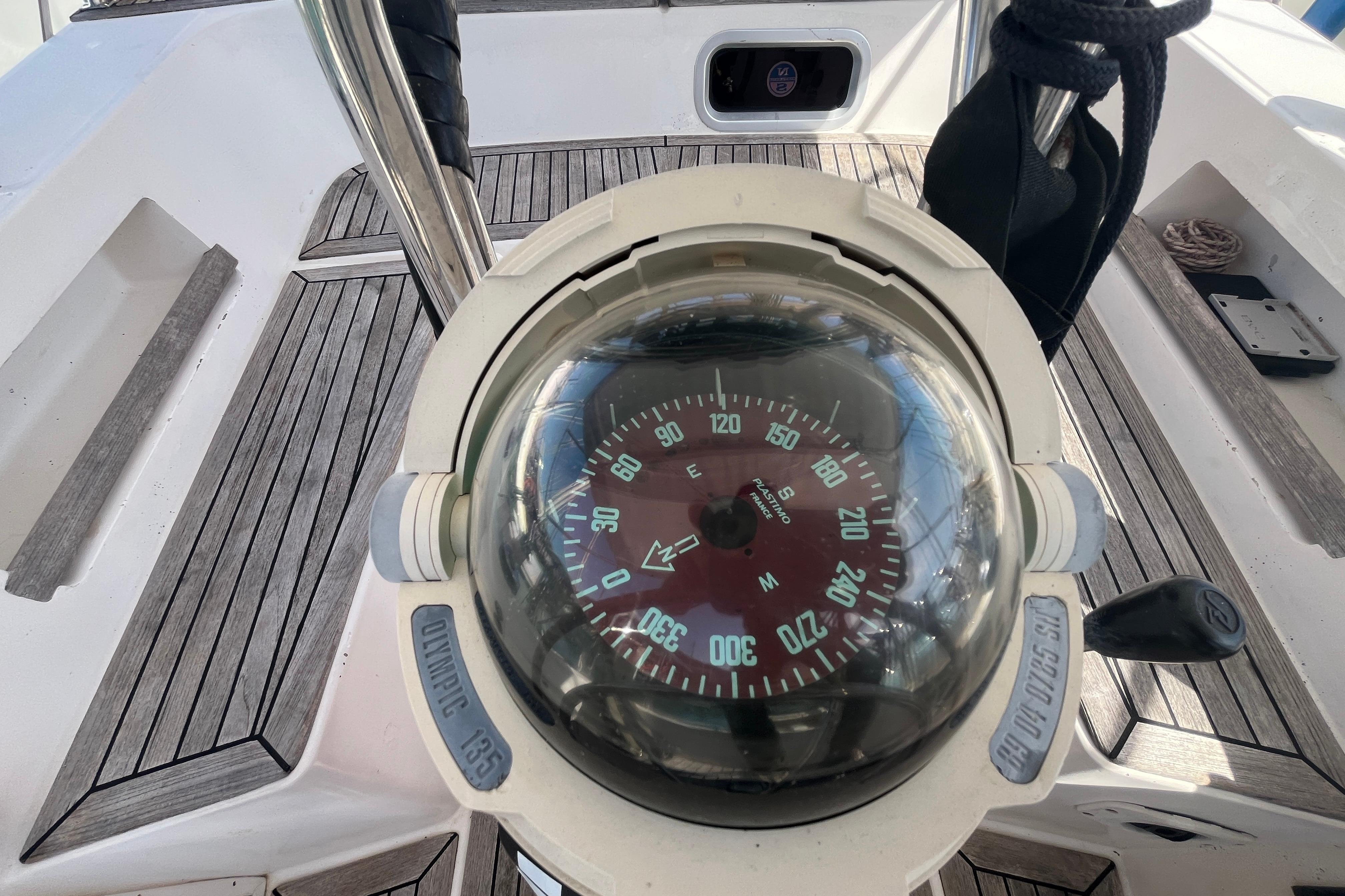 Compass on 1995 Belliure 41 yacht, featuring teak deck and navigational equipment.