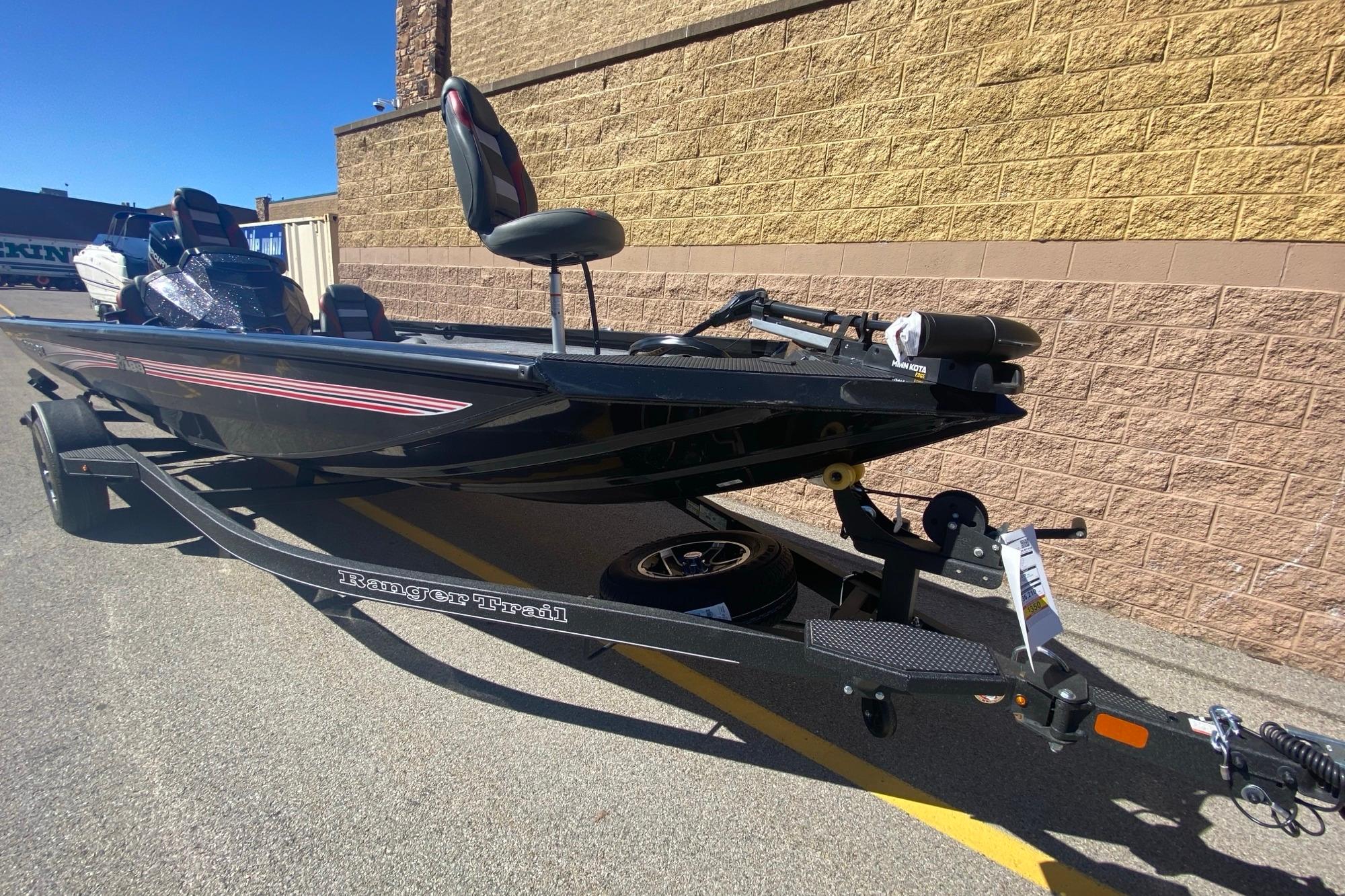 2026 Ranger RT188 boat on trailer, parked outdoors, side view.