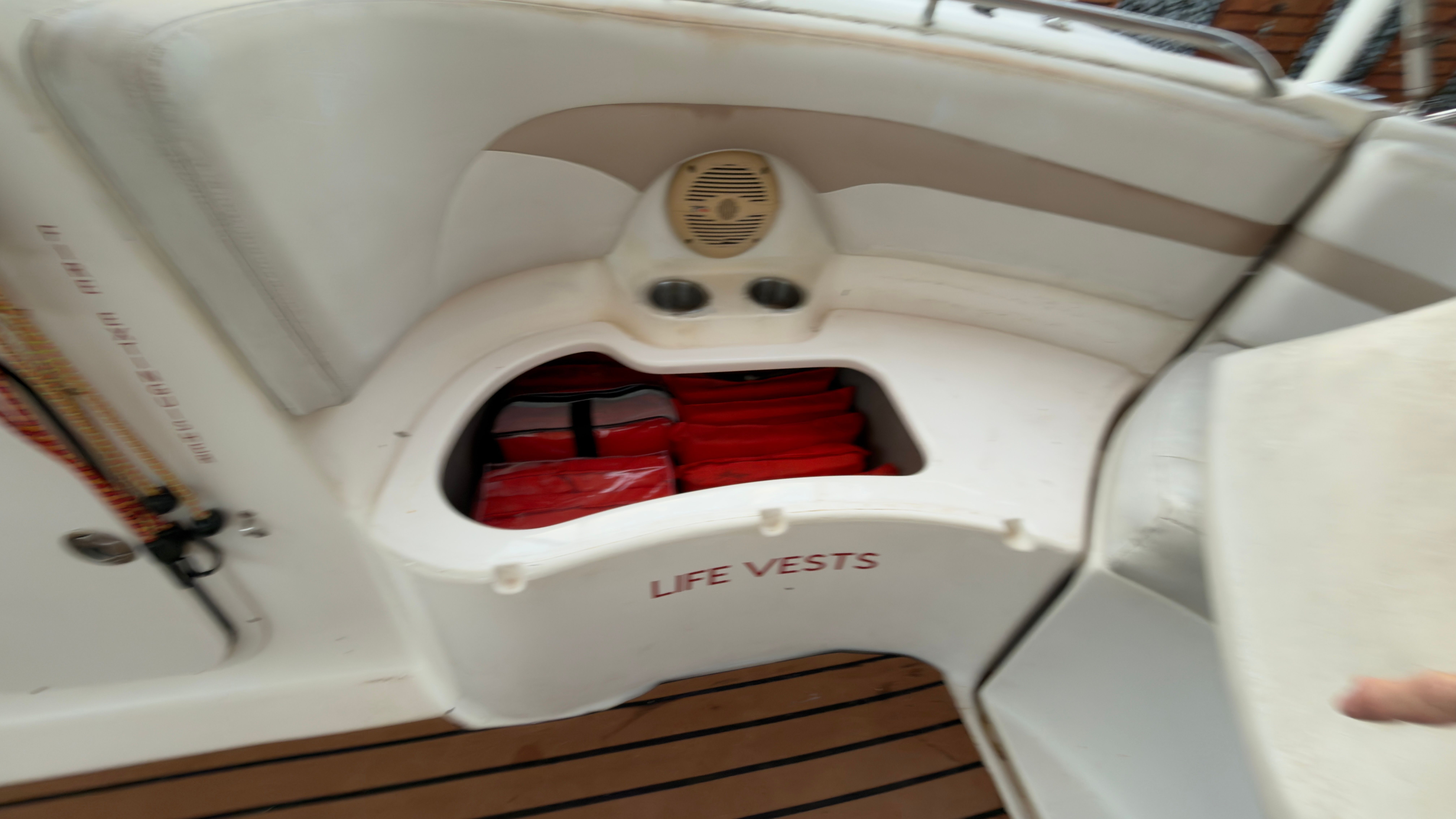 2003 Chaparral 263 Sunesta Deckboat with life vest compartment.