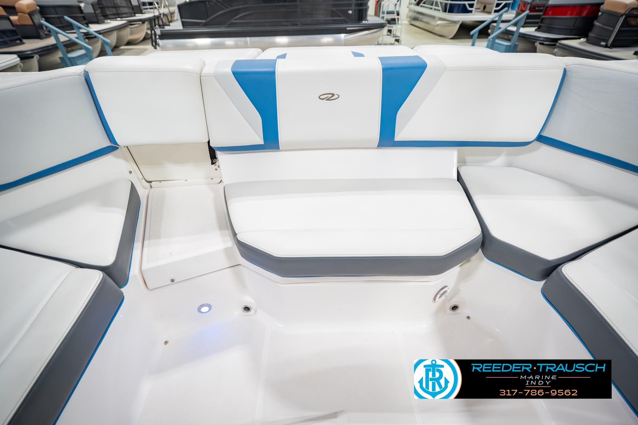 Interior seating of a 2015 Regal 2000 ESX Bowrider boat with white and blue upholstery.