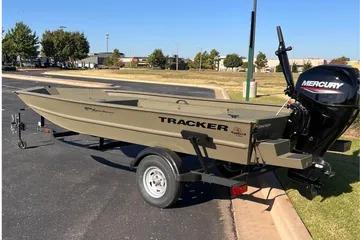 2026 Tracker Grizzly 1654 T Sportsman boat with Mercury engine on trailer.