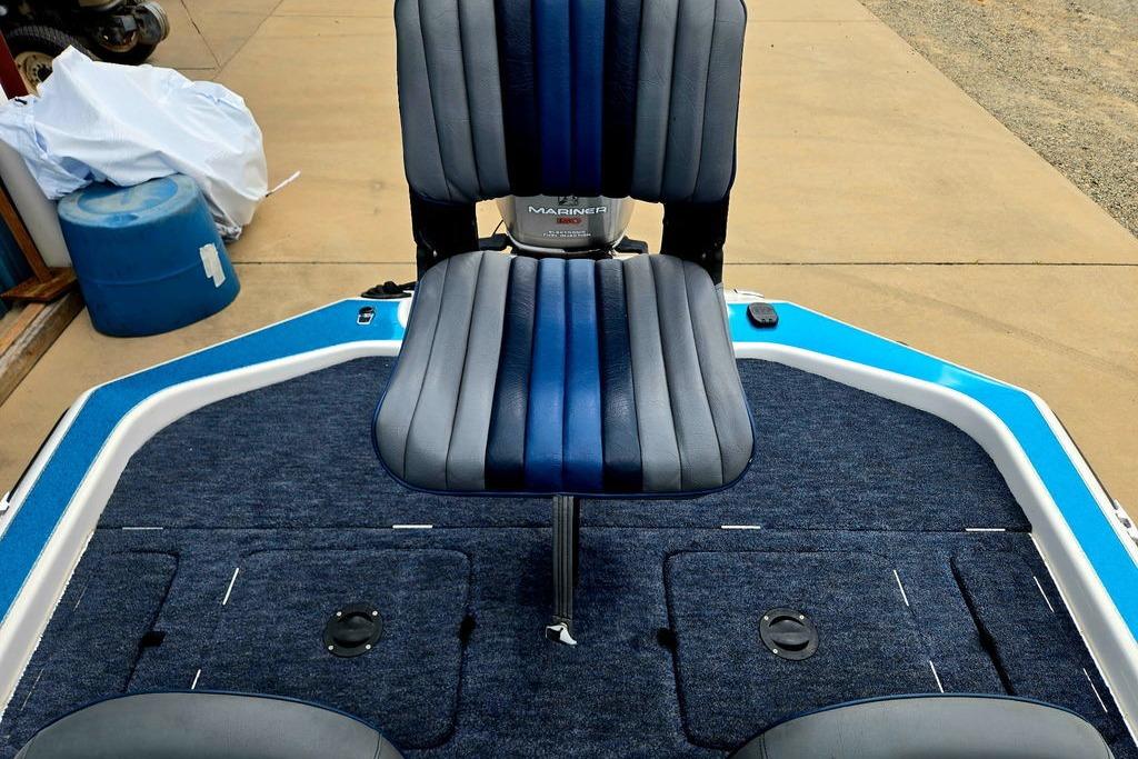 1996 Champion 181 SX boat interior with blue and gray seating on a carpeted deck.