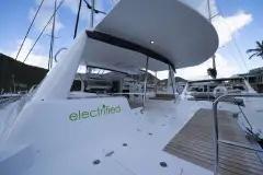 2018 Voyage Yachts 480E catamaran docked, featuring "electrified" branding on the side.