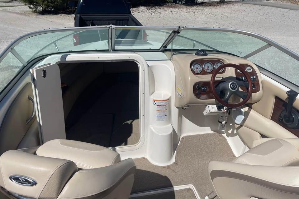 2007 Chaparral 215 SSi boat interior with steering wheel and seating area.