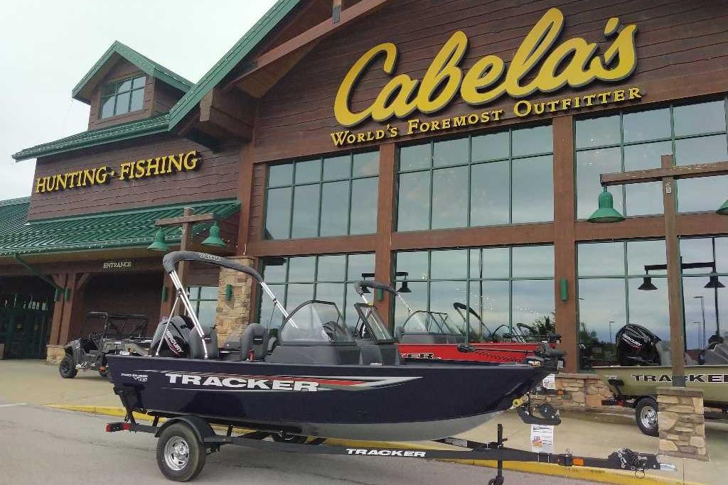 2026 Tracker Pro Guide V-16 WT boat displayed outside Cabela's store.
