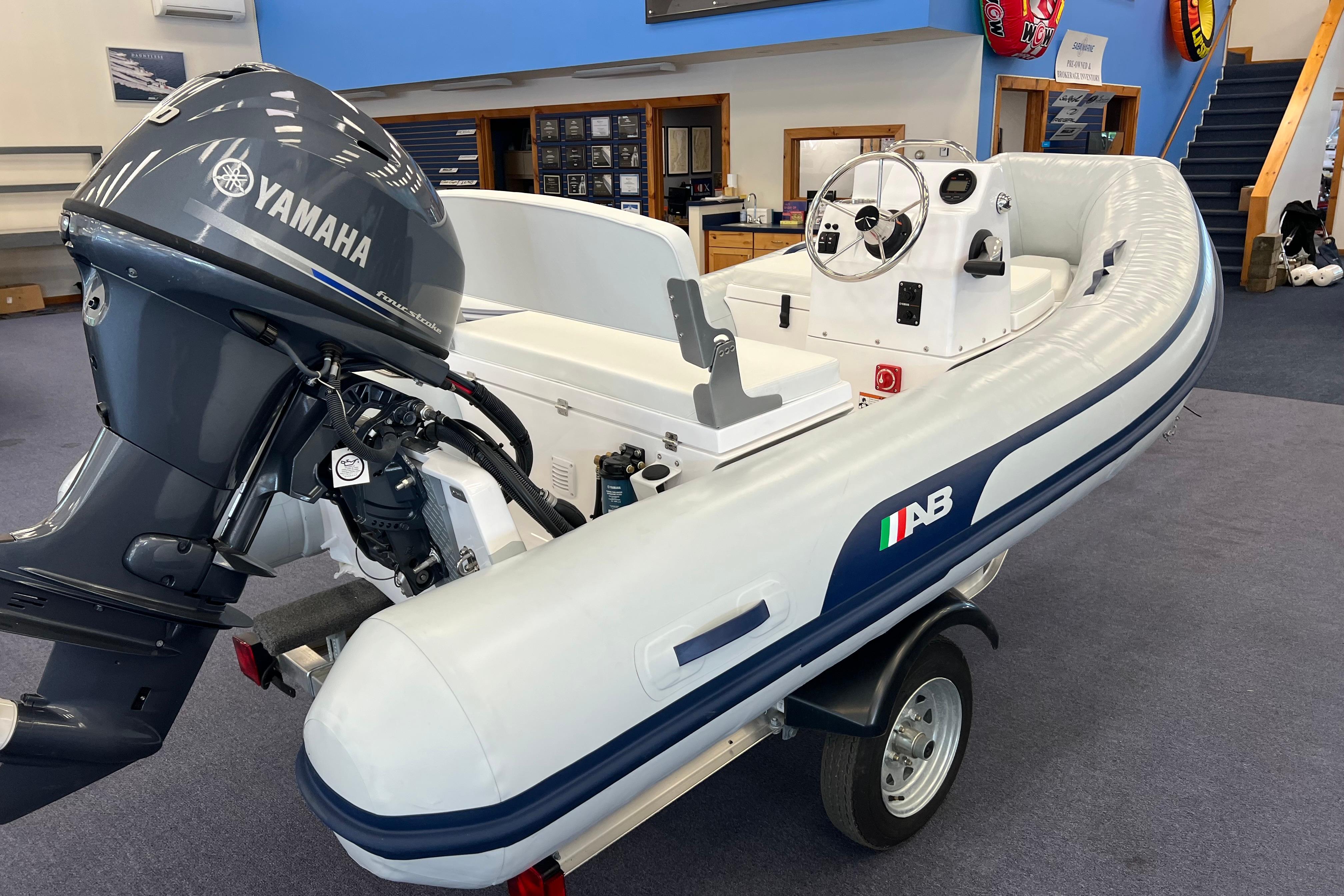 2023 AB Inflatables Mares 12 VSX boat with Yamaha engine in showroom.