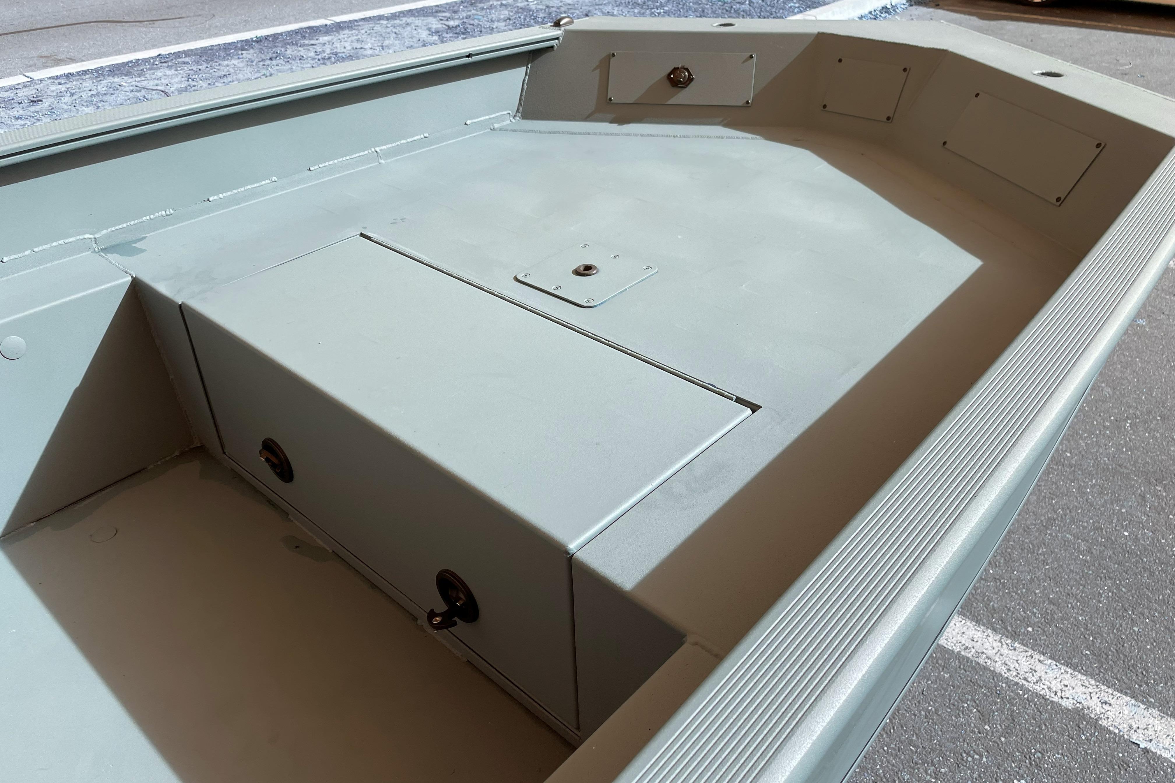 2026 Tracker Grizzly 1650 T Prairie Wings Edition boat interior, showcasing storage compartments.