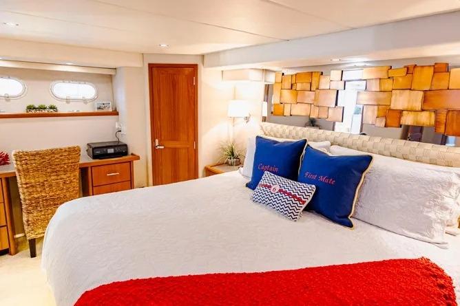 Luxurious bedroom in 2000 Pacific Mariner 65 Motoryacht with elegant decor and cozy bedding.