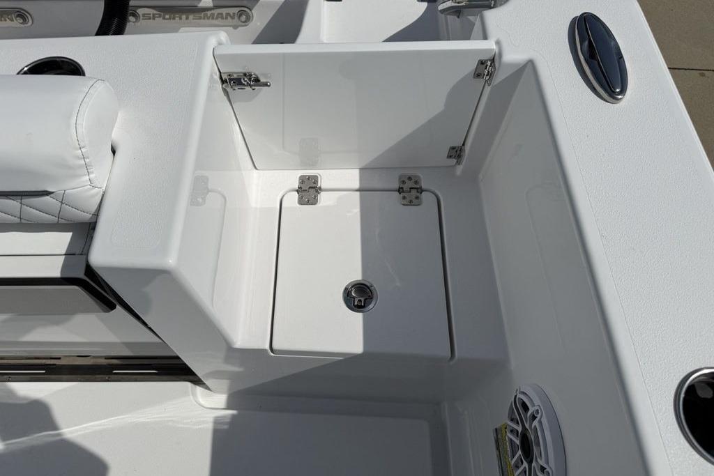 2026 Sportsman Open 252 Center Console boat interior with storage compartment and seating.