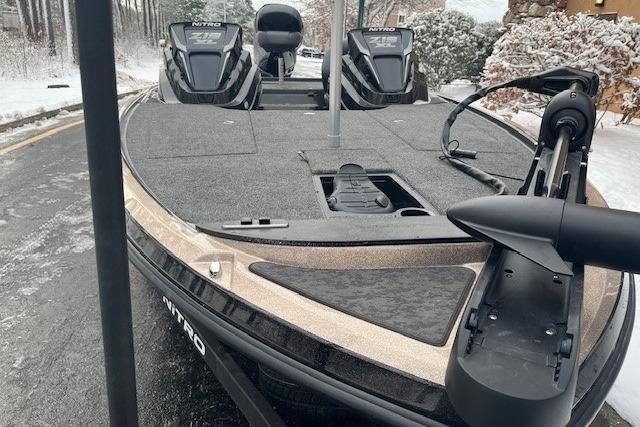 2026 Nitro Z19 XL boat on snowy road, featuring dual engines and sleek design.