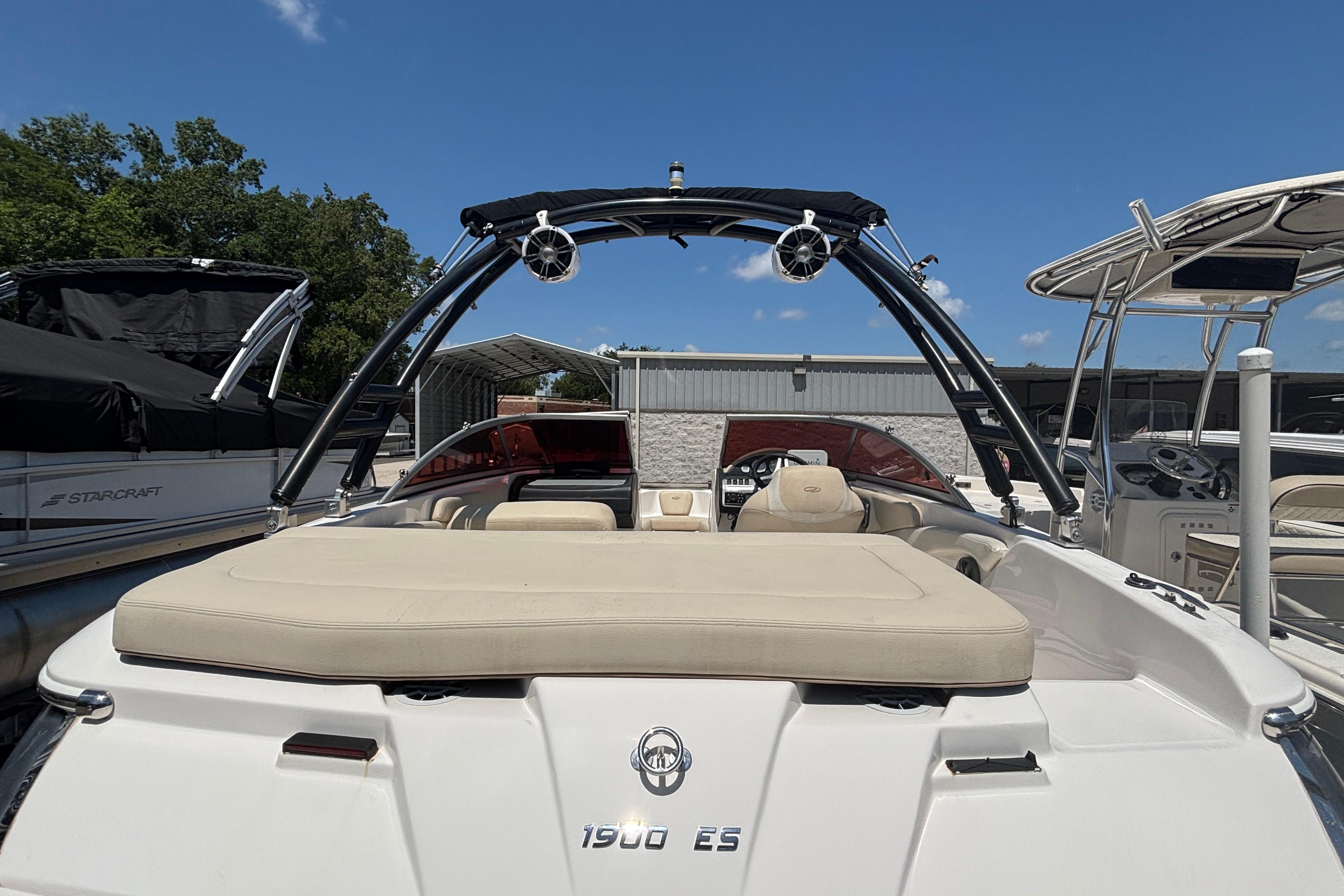 2018 Regal 1900 ES Bowrider boat with sleek design and spacious seating.