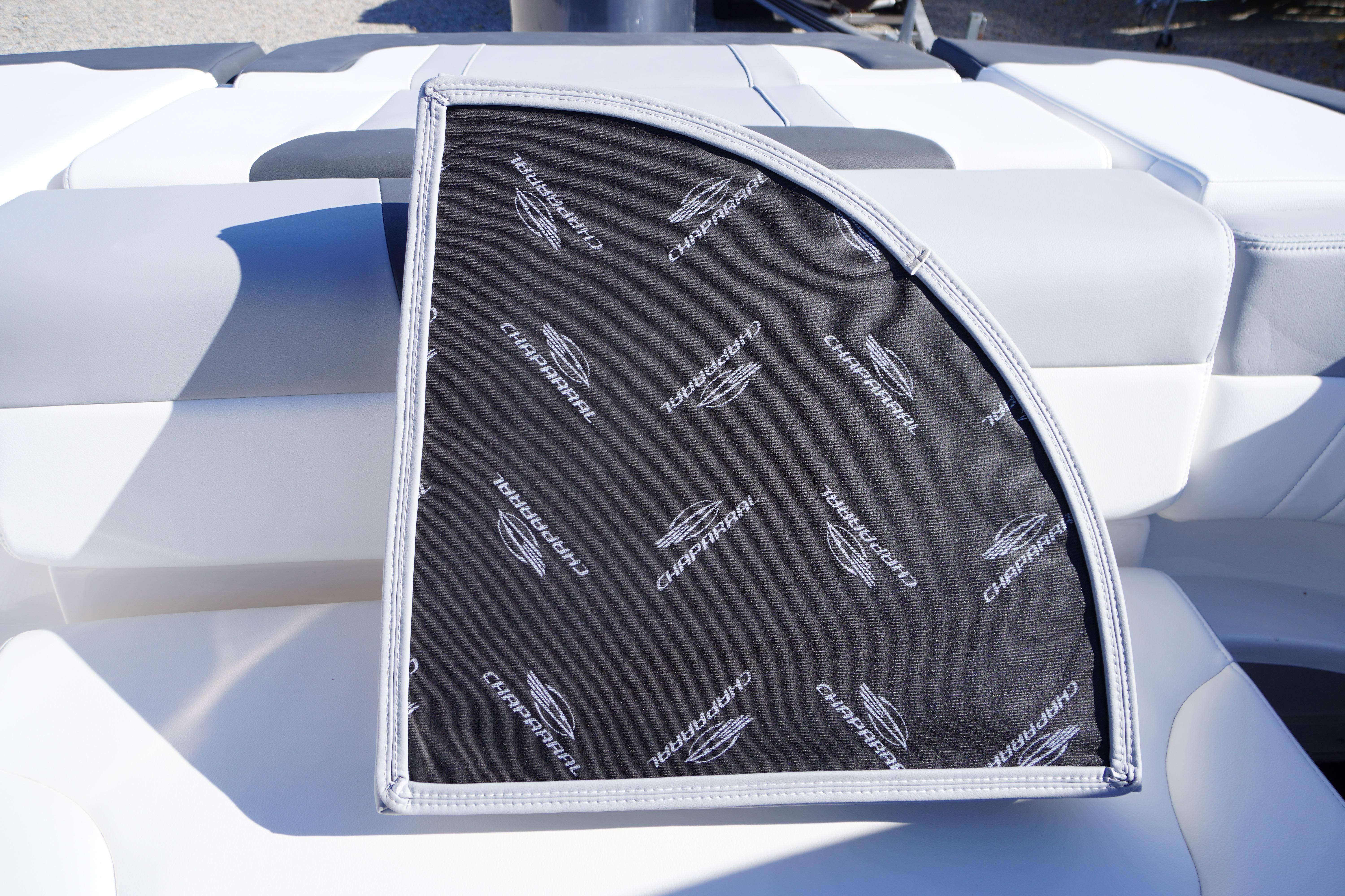 2026 Chaparral 23 SSi OB boat seat with branded cover, showcasing luxury design.