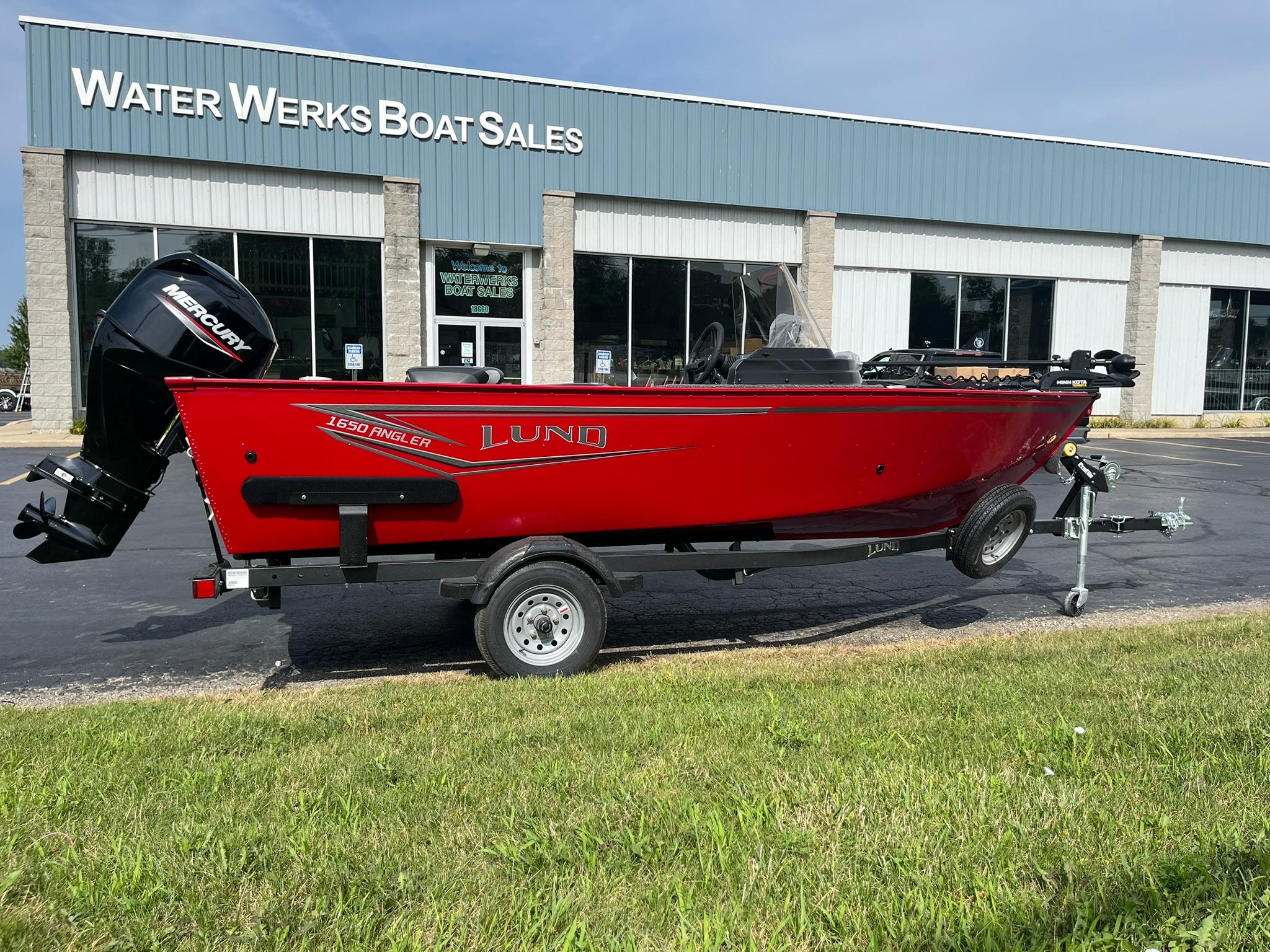 2026 Lund 1650 Angler SS boat in red, parked at Water Werks Boat Sales.