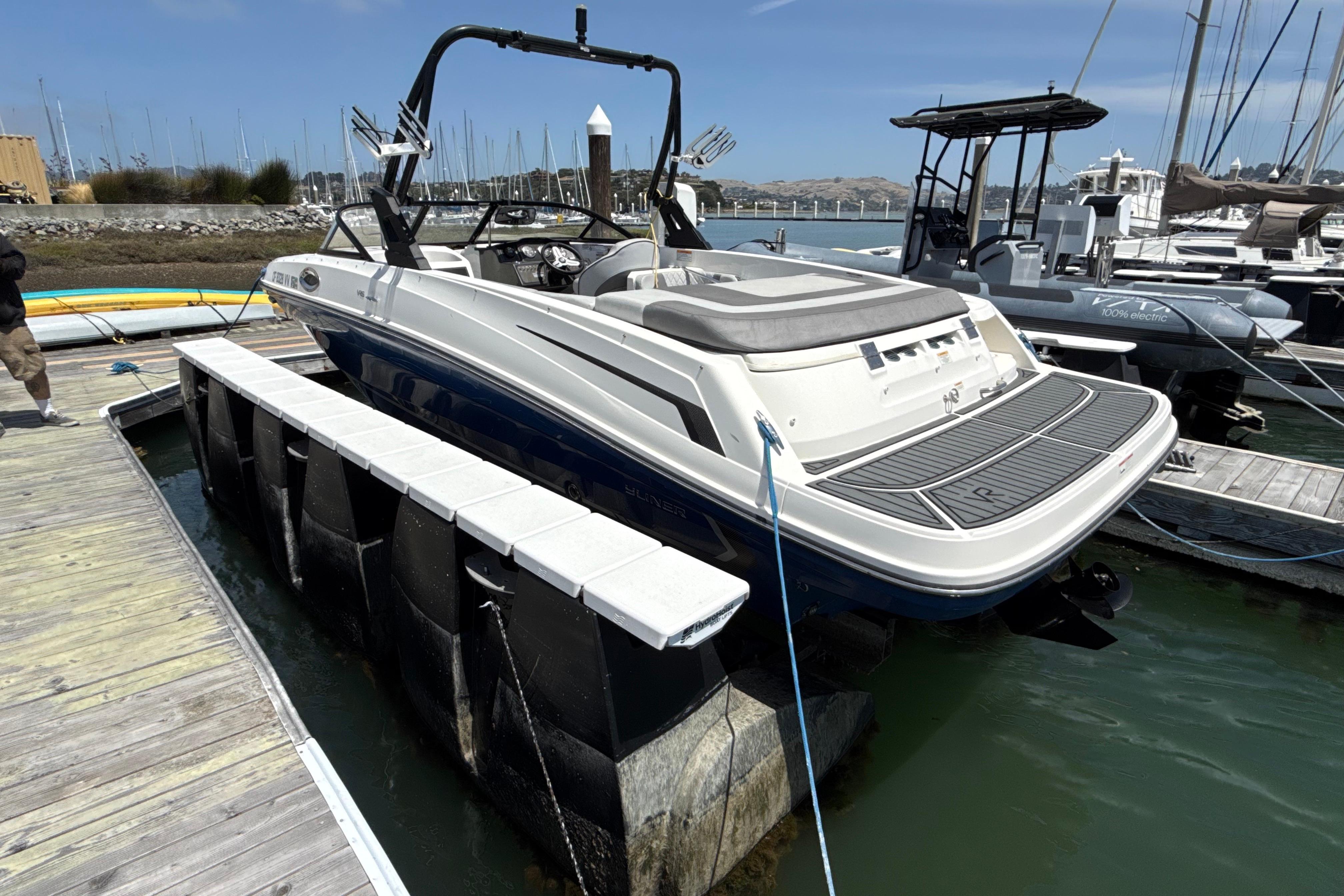 2021 Bayliner VR5 Bowrider I/O docked at marina, showcasing sleek design and spacious deck.