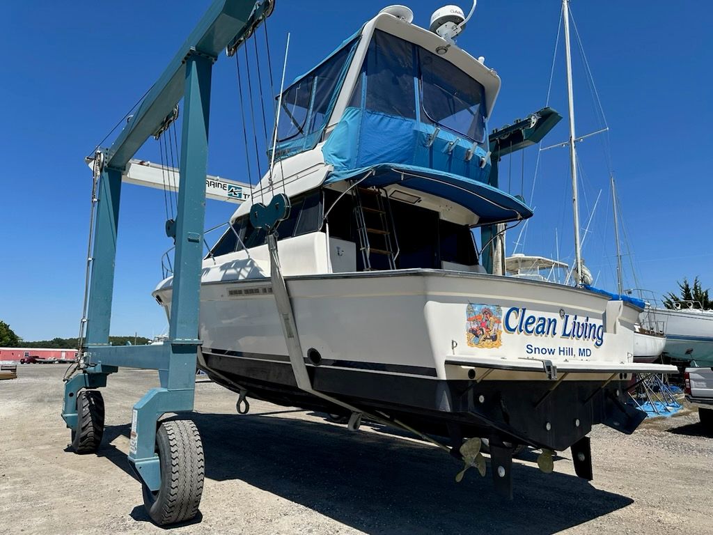 1990 Silverton Convertible boat on a boat lift.