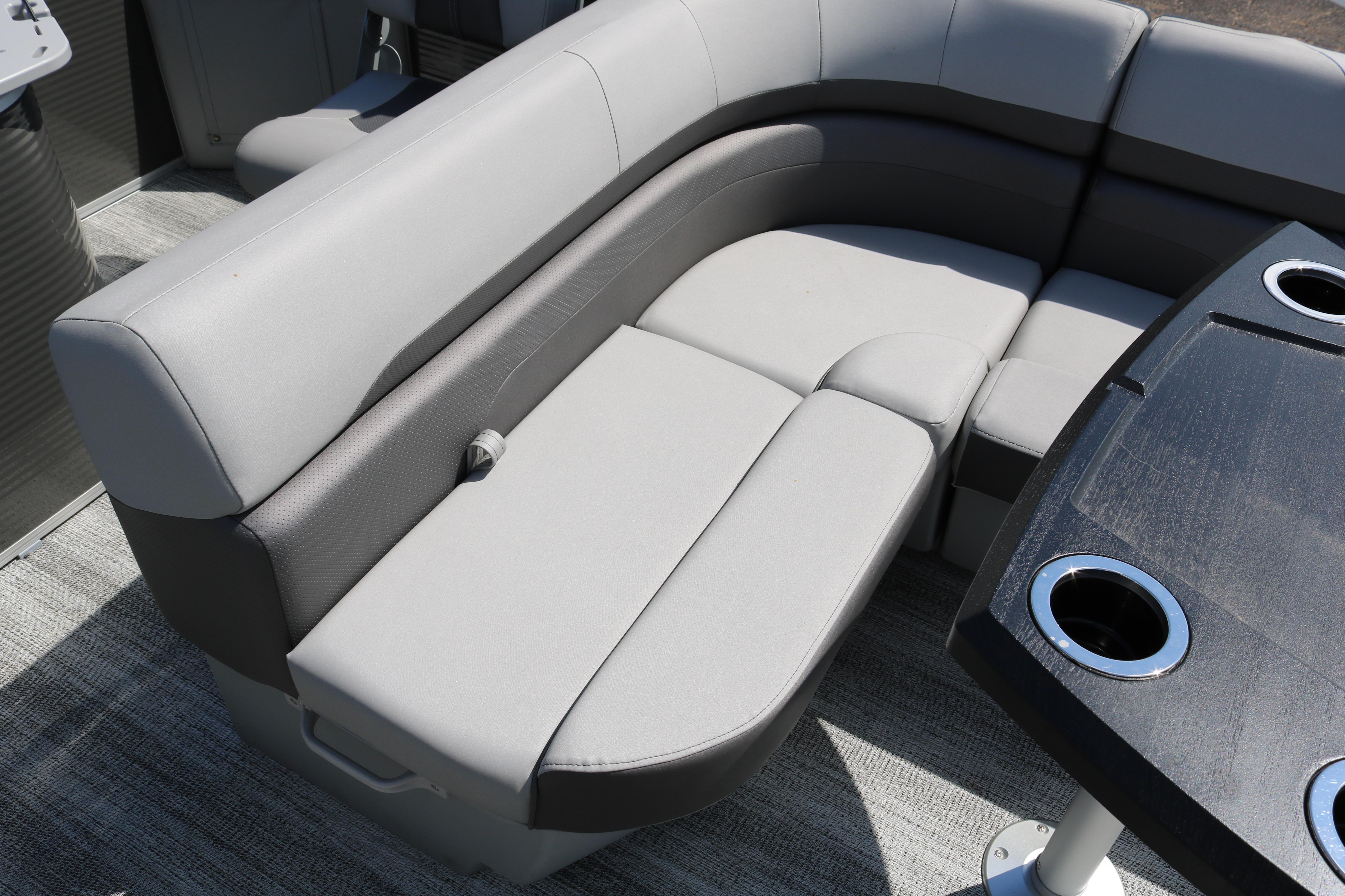 2026 Bennington 20SXSNP REAR FISH boat interior with gray seating and table with cup holders.
