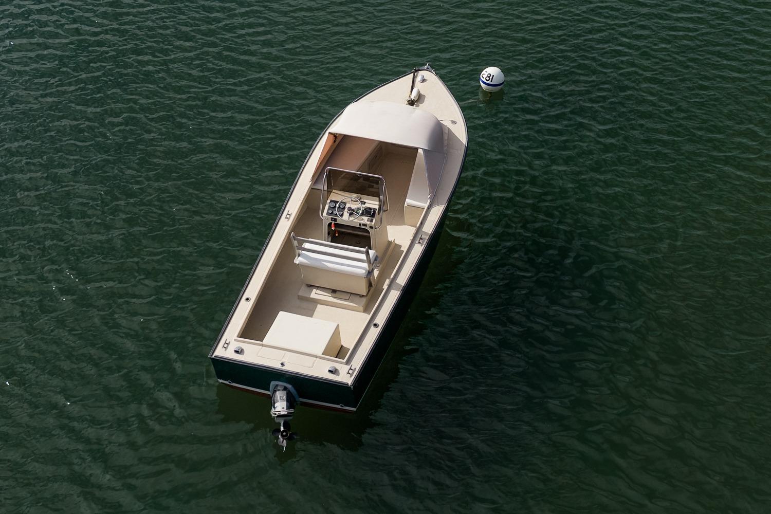 Aerial view of 1989 Ellis 24 Open boat on calm water.