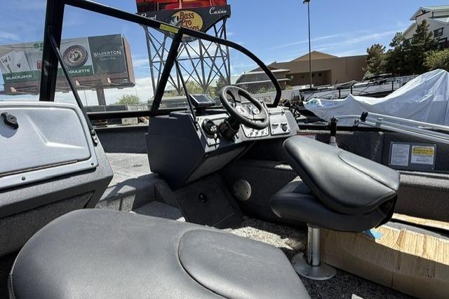 2025 Tracker Pro Guide V-175 WT boat interior with steering wheel and seating.