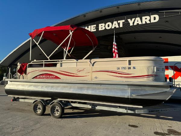 2005 Starcraft 22 Sport pontoon boat with red canopy at The Boat Yard.