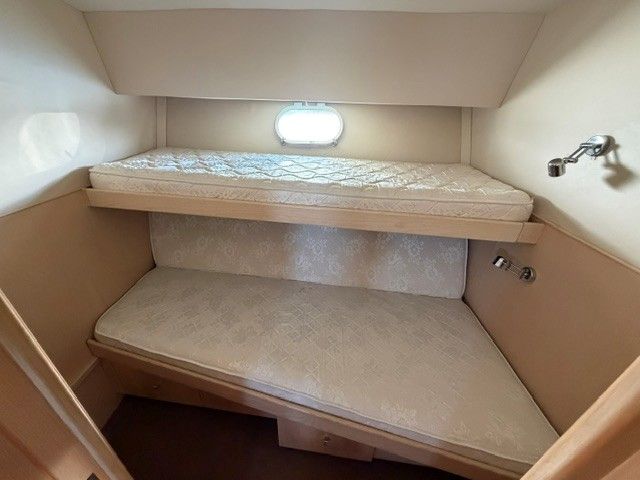 Interior of a 1990 Custom MOTOR YACHT with bunk beds.