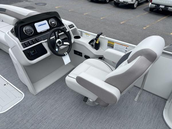 2025 Godfrey SWEETWATER 2286 SFL boat interior with steering console and captain's chair.