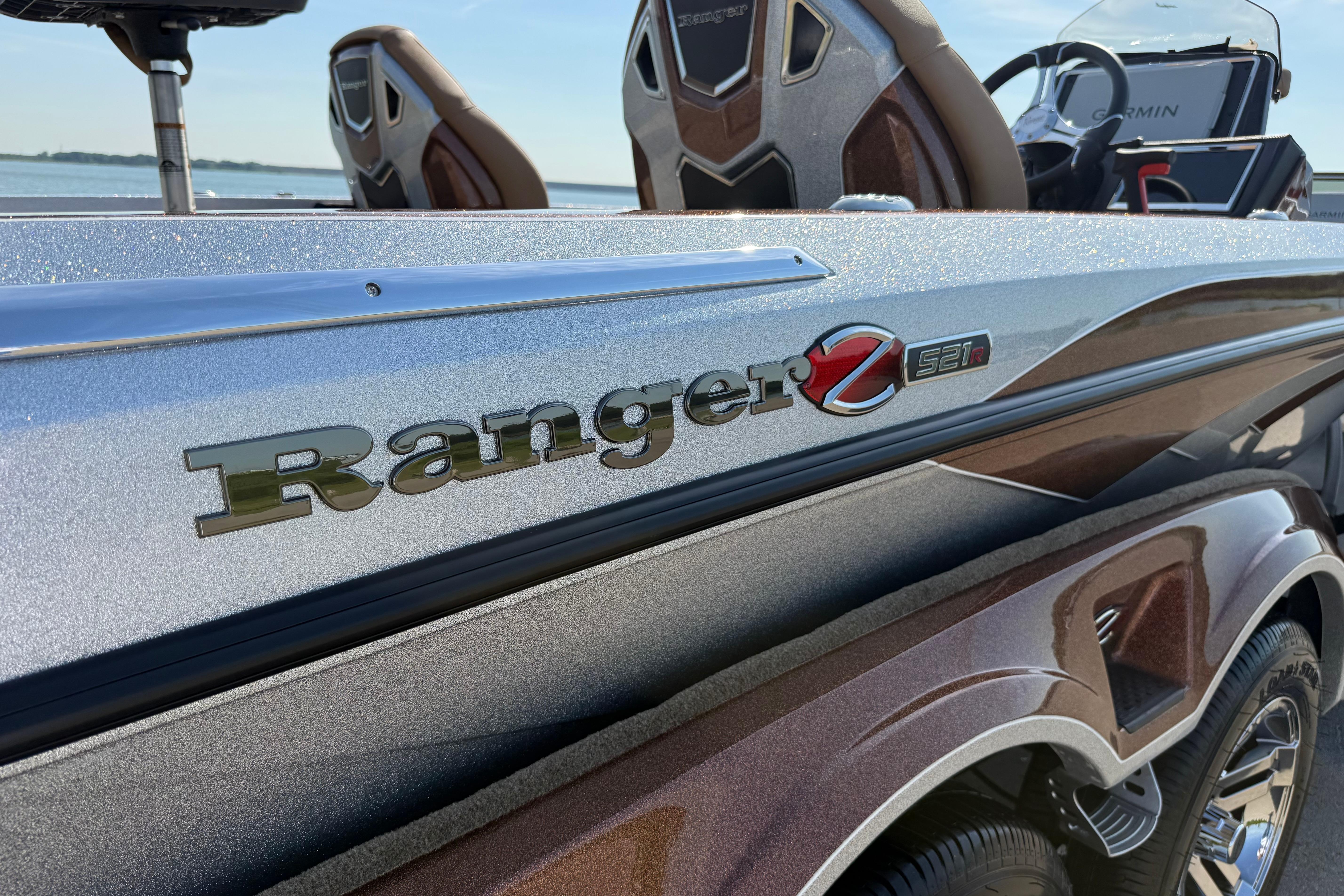 2026 Ranger Z521R boat, close-up of logo and sleek design by the water.