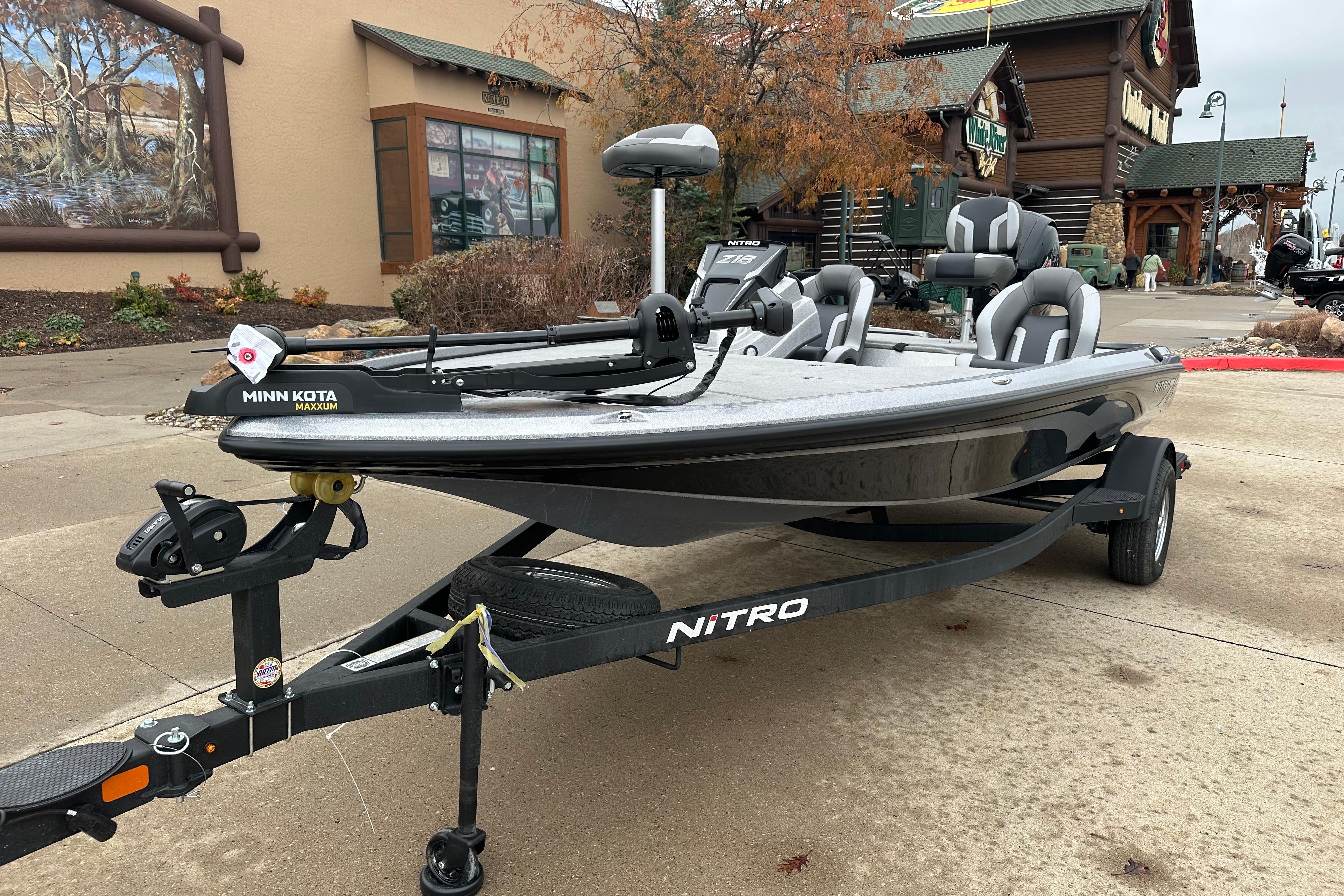 2026 Nitro Z18 boat with Minn Kota motor on trailer, parked outdoors.