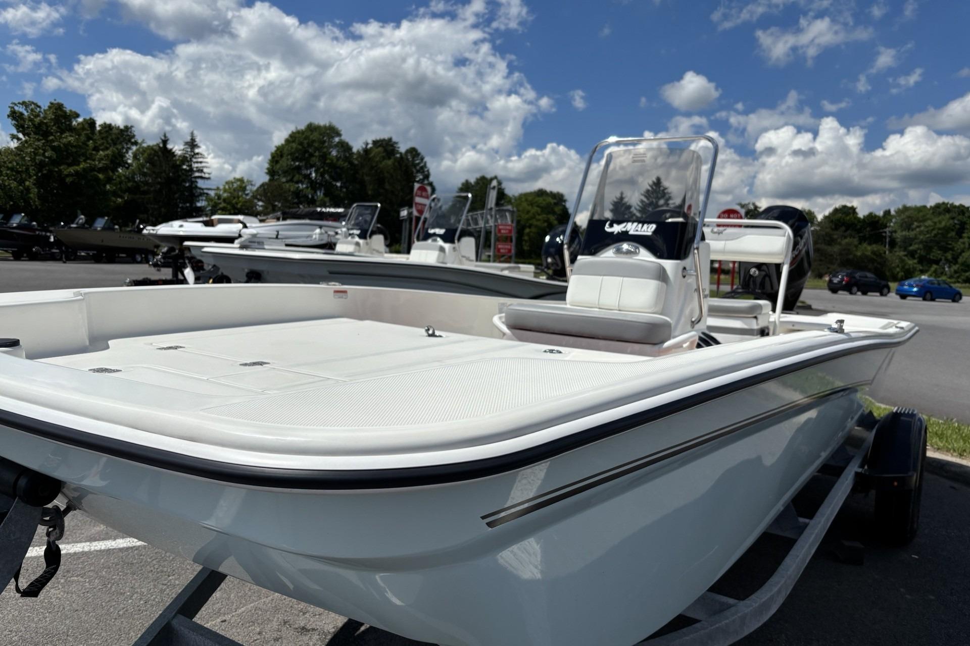 2026 Mako Pro Skiff 15 CC boat on trailer under blue sky.