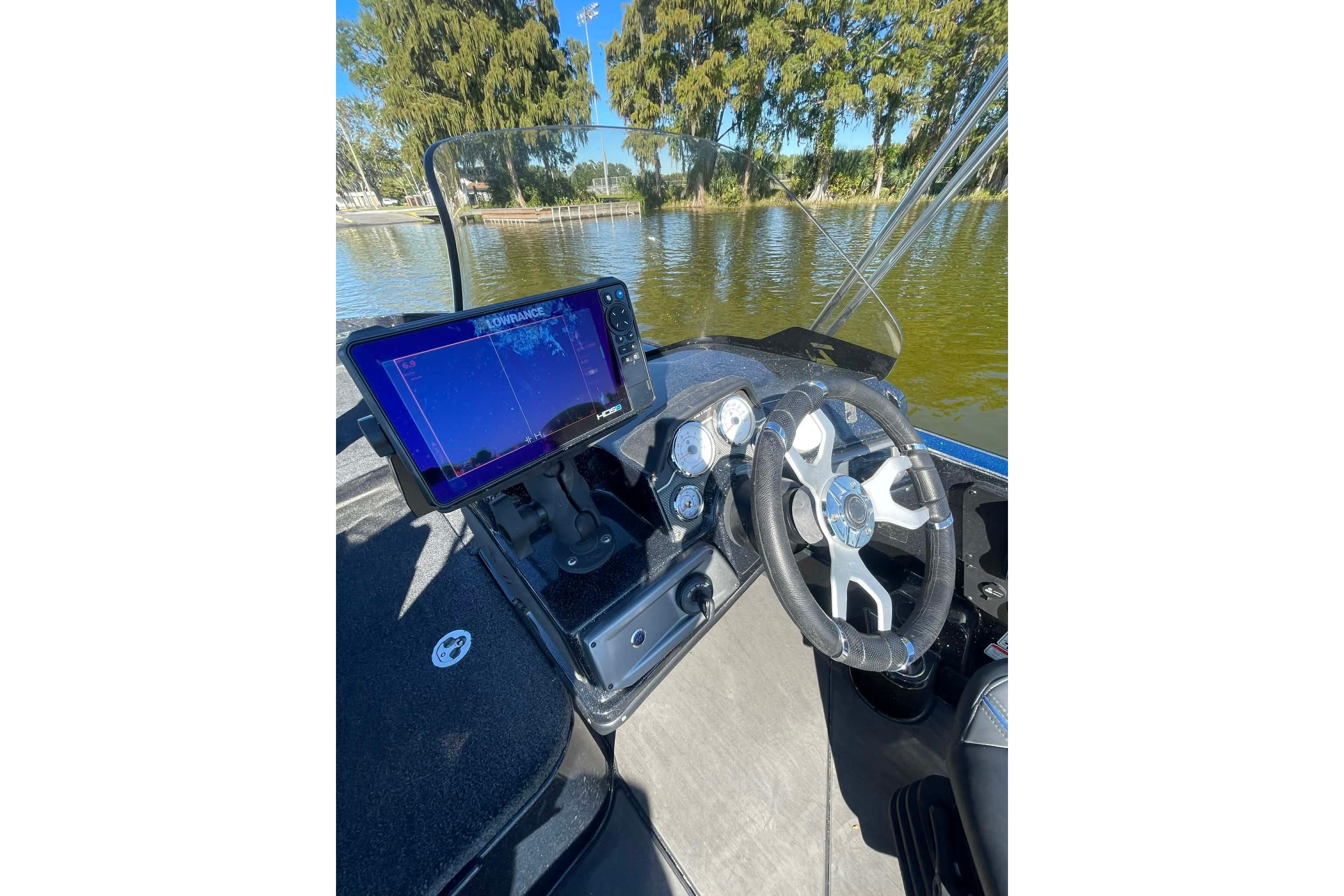 2024 Nitro ZV21 boat dashboard with steering wheel and navigation display.