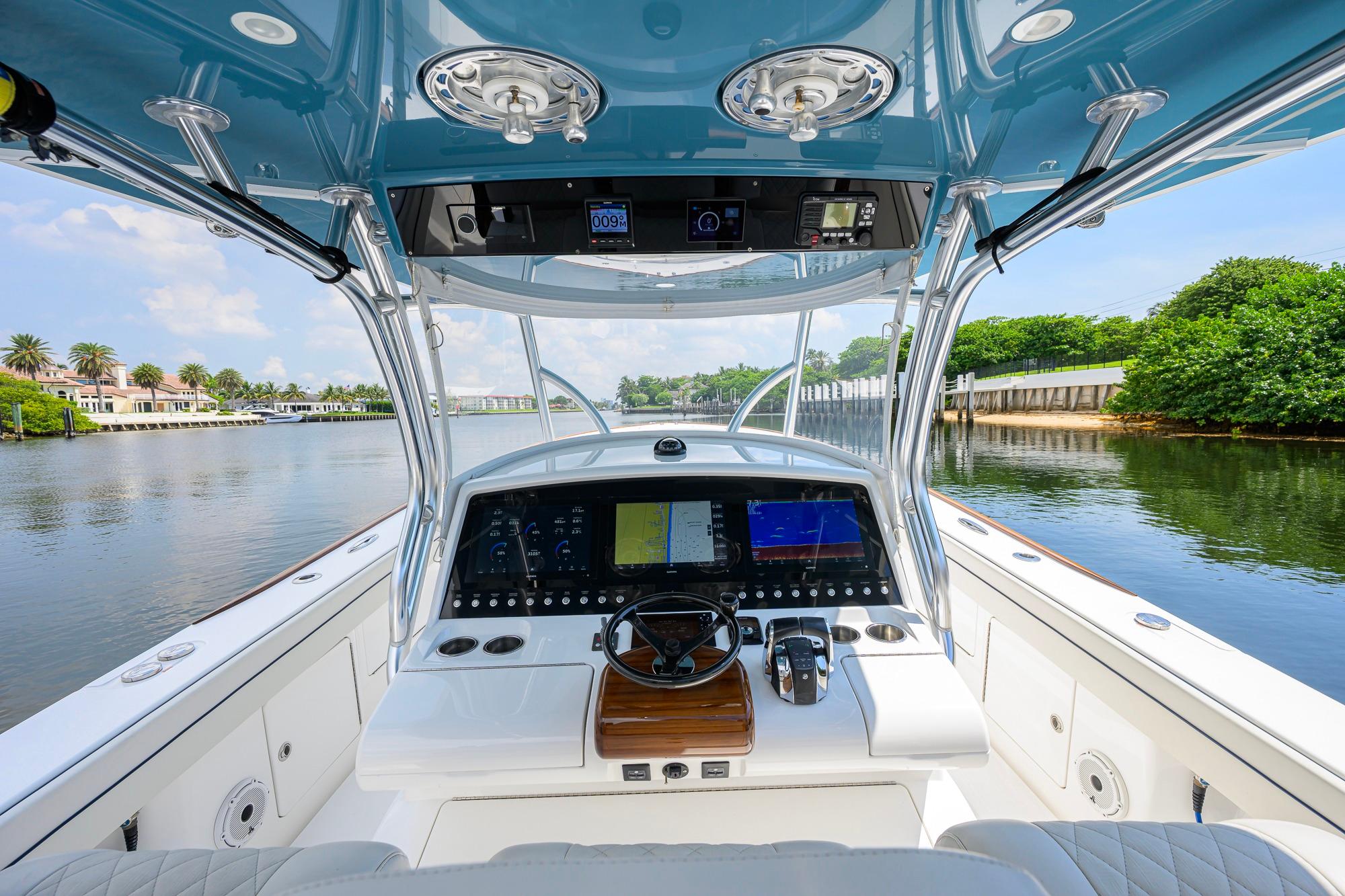 2020 Valhalla Boatworks V-41 helm with advanced navigation system on a scenic waterway.