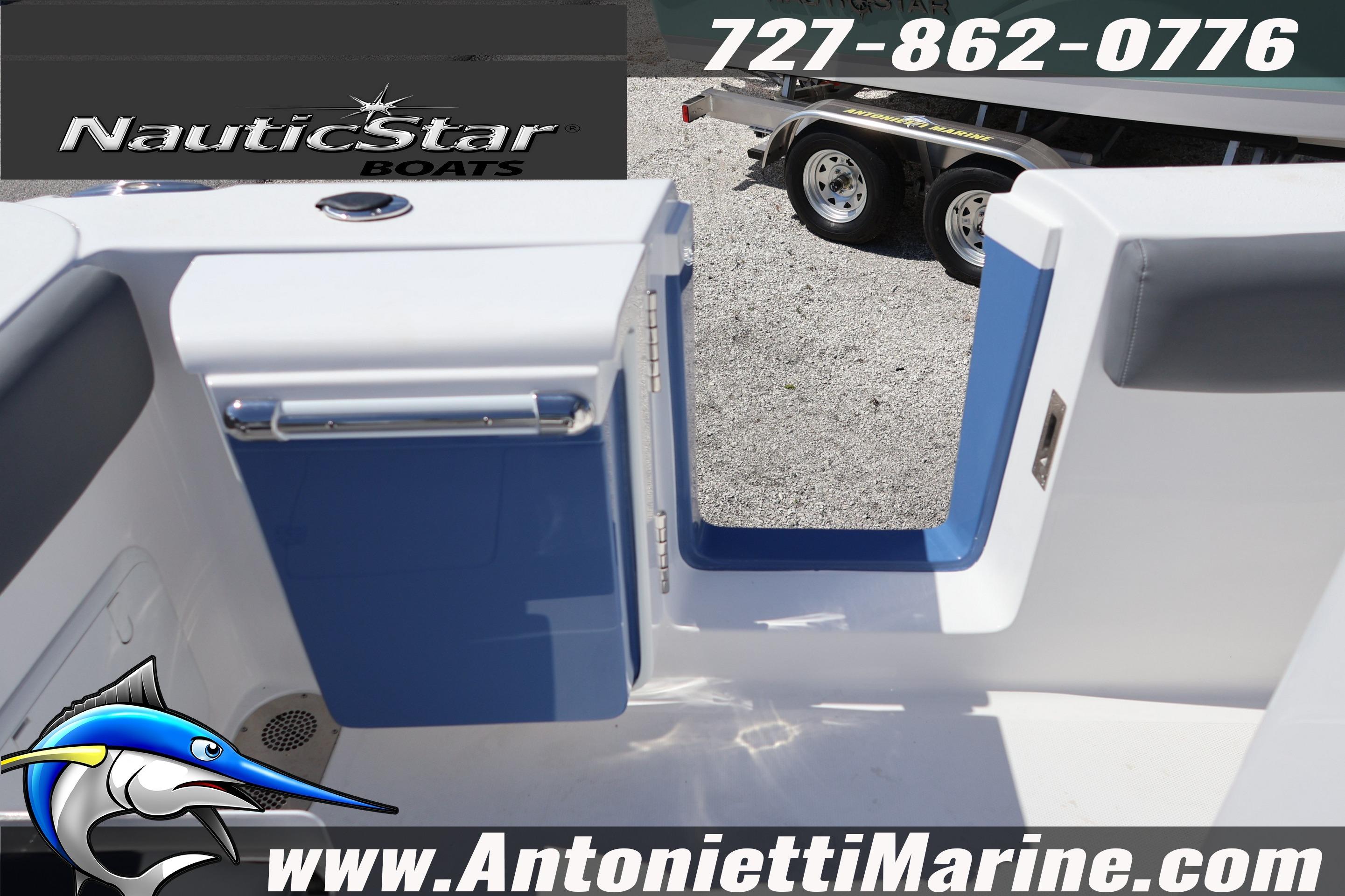 2026 NauticStar 292 Legacy boat entryway with blue accents, displayed by Antonietti Marine.