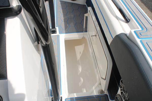 2024 Fountain 34 SC boat interior with open storage compartment and hexagonal floor design.