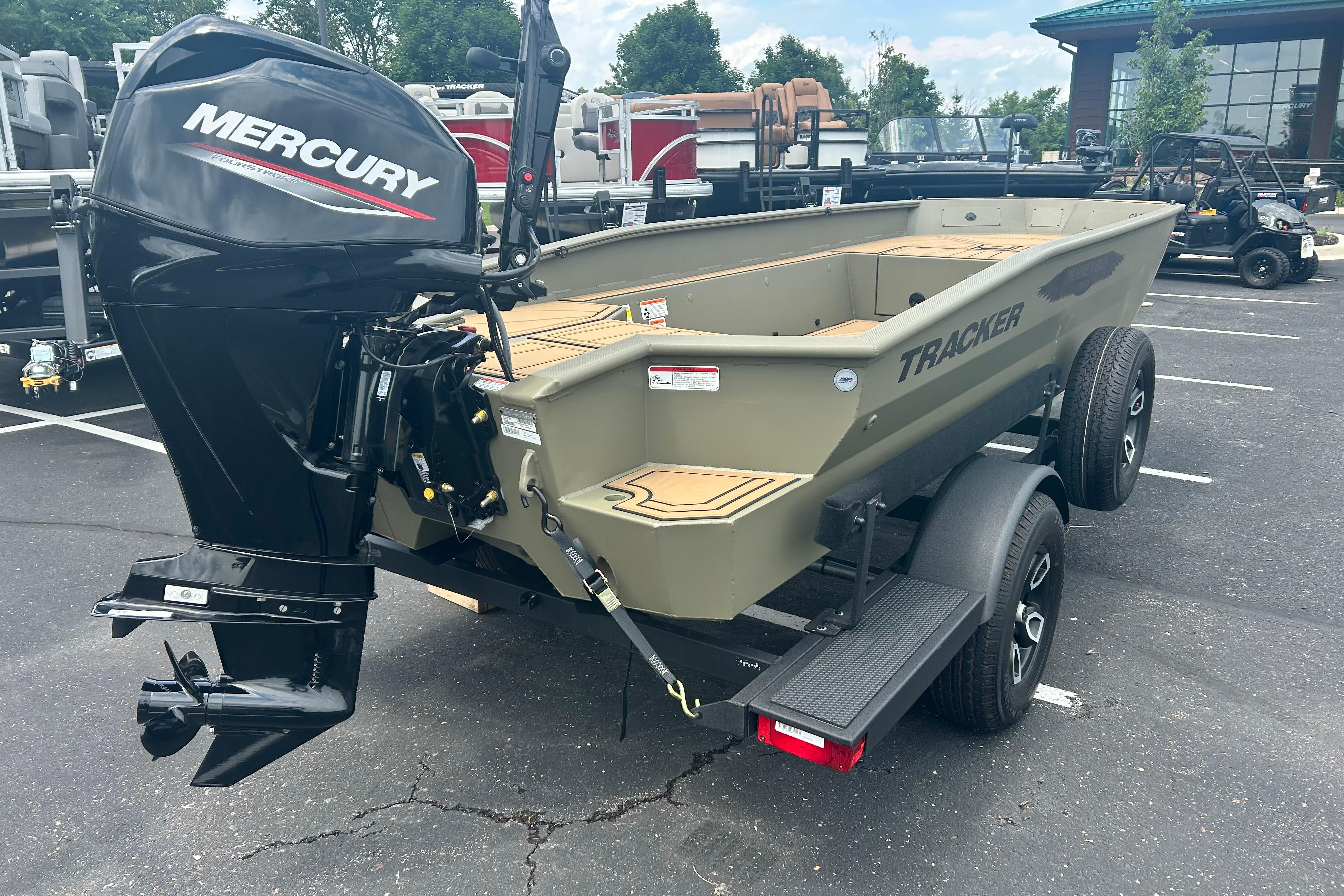 2026 Tracker Grizzly 1650 T Prairie Wings Edition boat with Mercury engine on trailer.