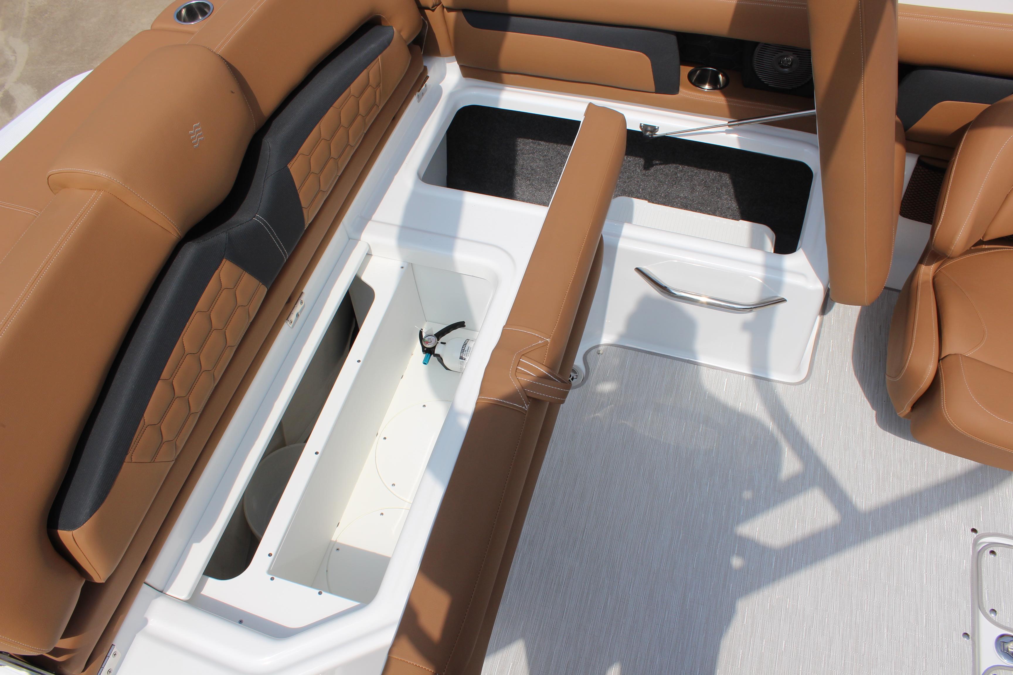 2025 Four Winns HD3 OB boat interior with tan seating and storage compartments.