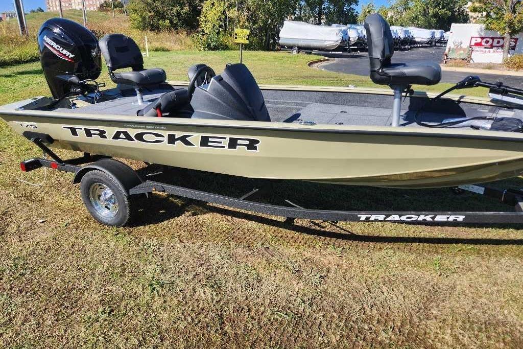 2026 Tracker Pro Team 175 Crappie Edition boat on trailer, parked on grass.